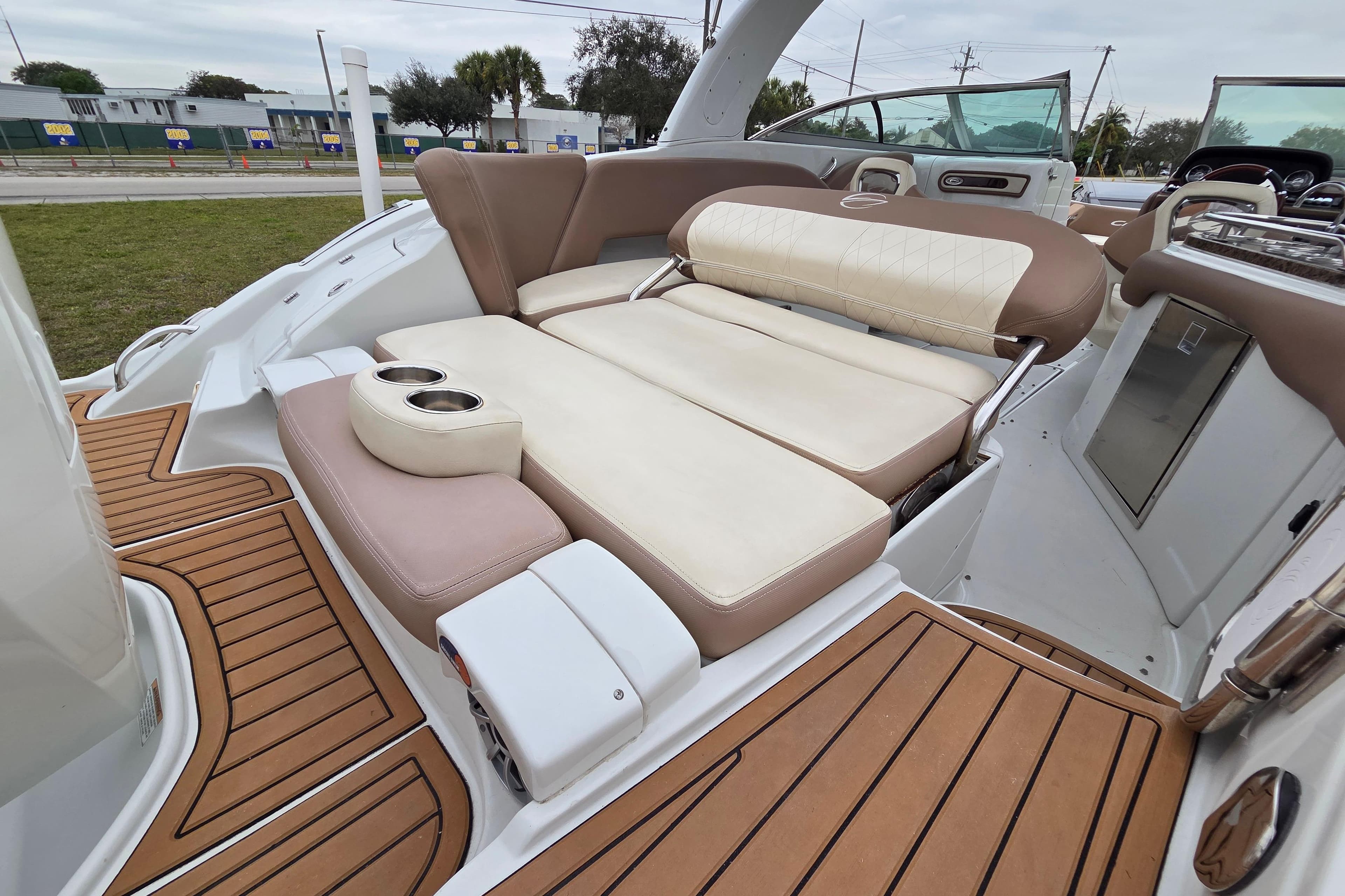 2019 Crownline Eclipse E275 XS boat interior with luxurious seating and teak flooring.