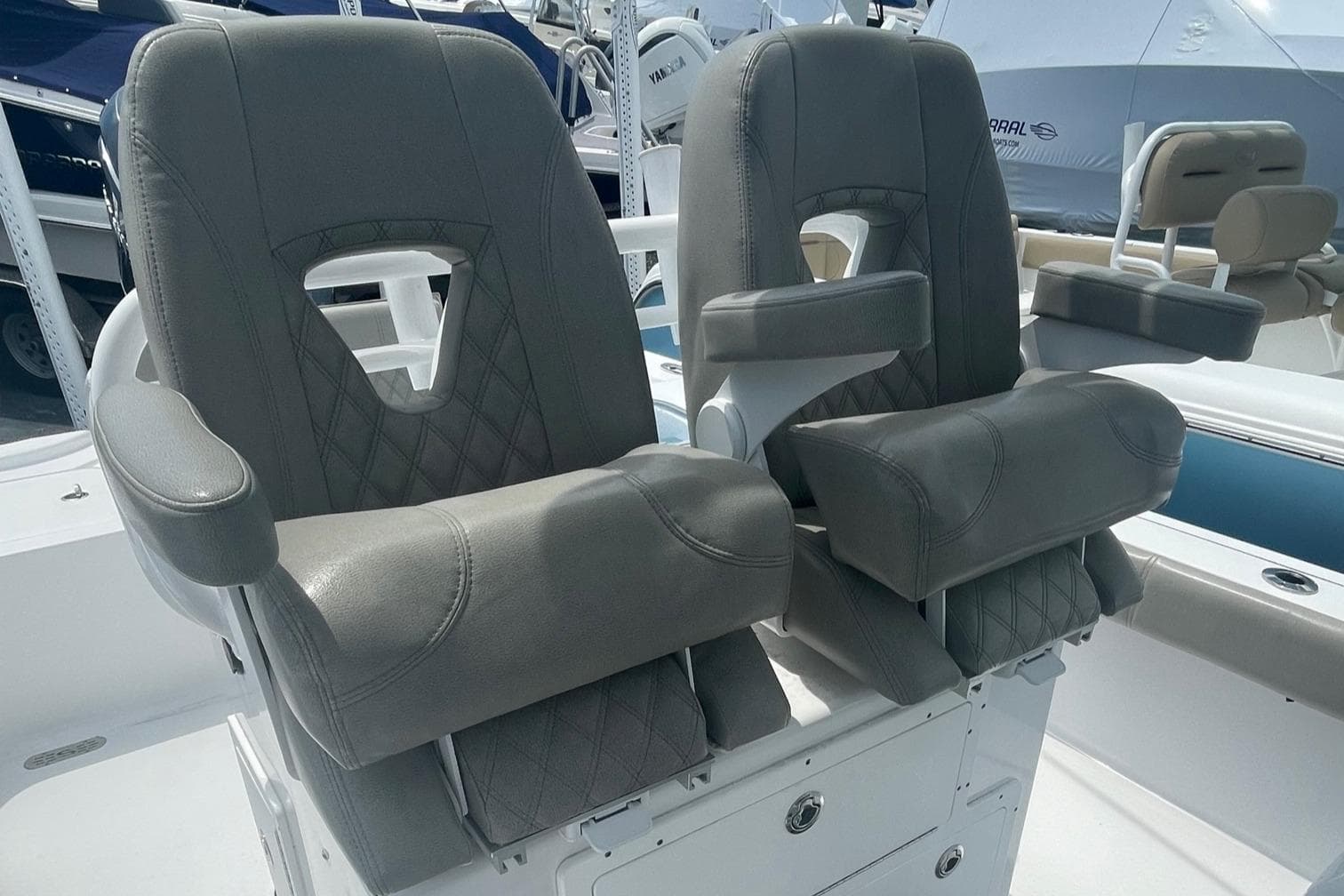 2021 Sportsman Masters 267OE Bay Boat, dual captain's chairs, gray upholstery.