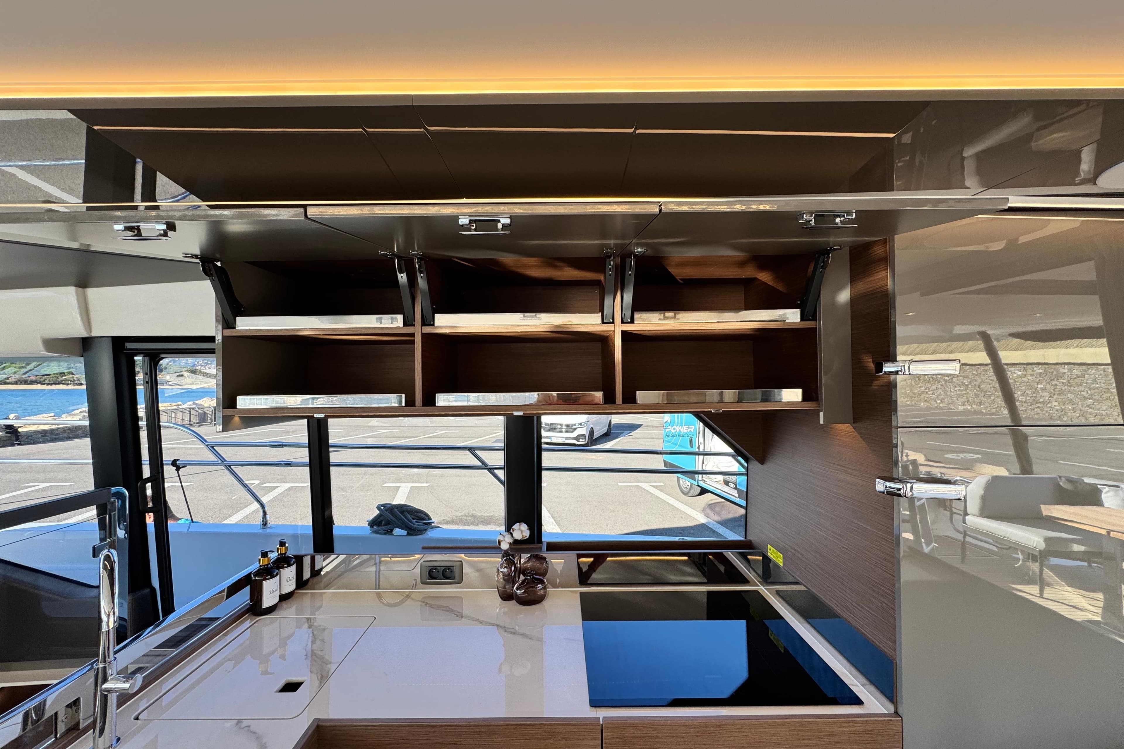 Modern kitchen interior of 2024 Prestige M48 yacht with sleek cabinetry and appliances.
