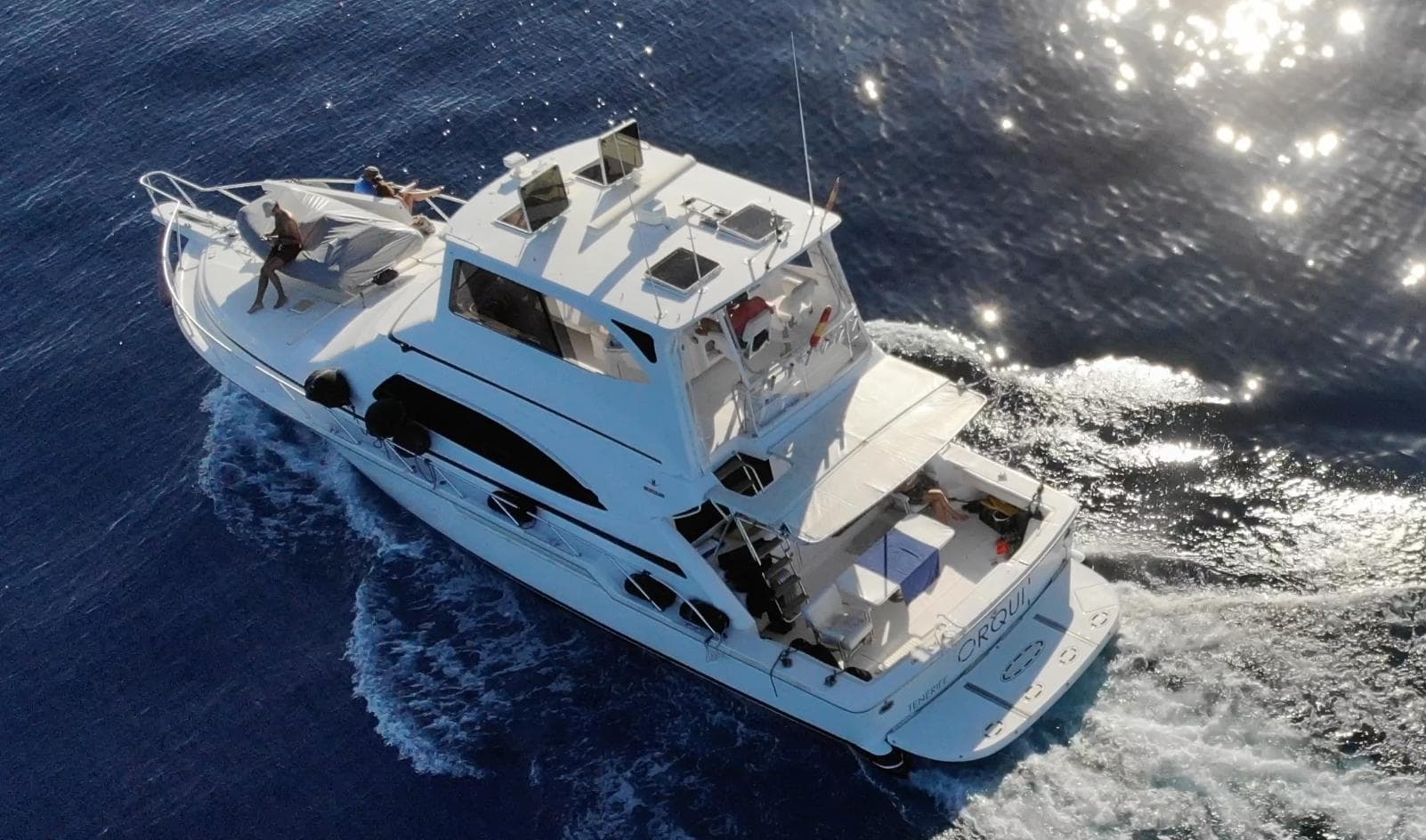 Aerial view of a 2004 Bertram 510 yacht cruising on the ocean.