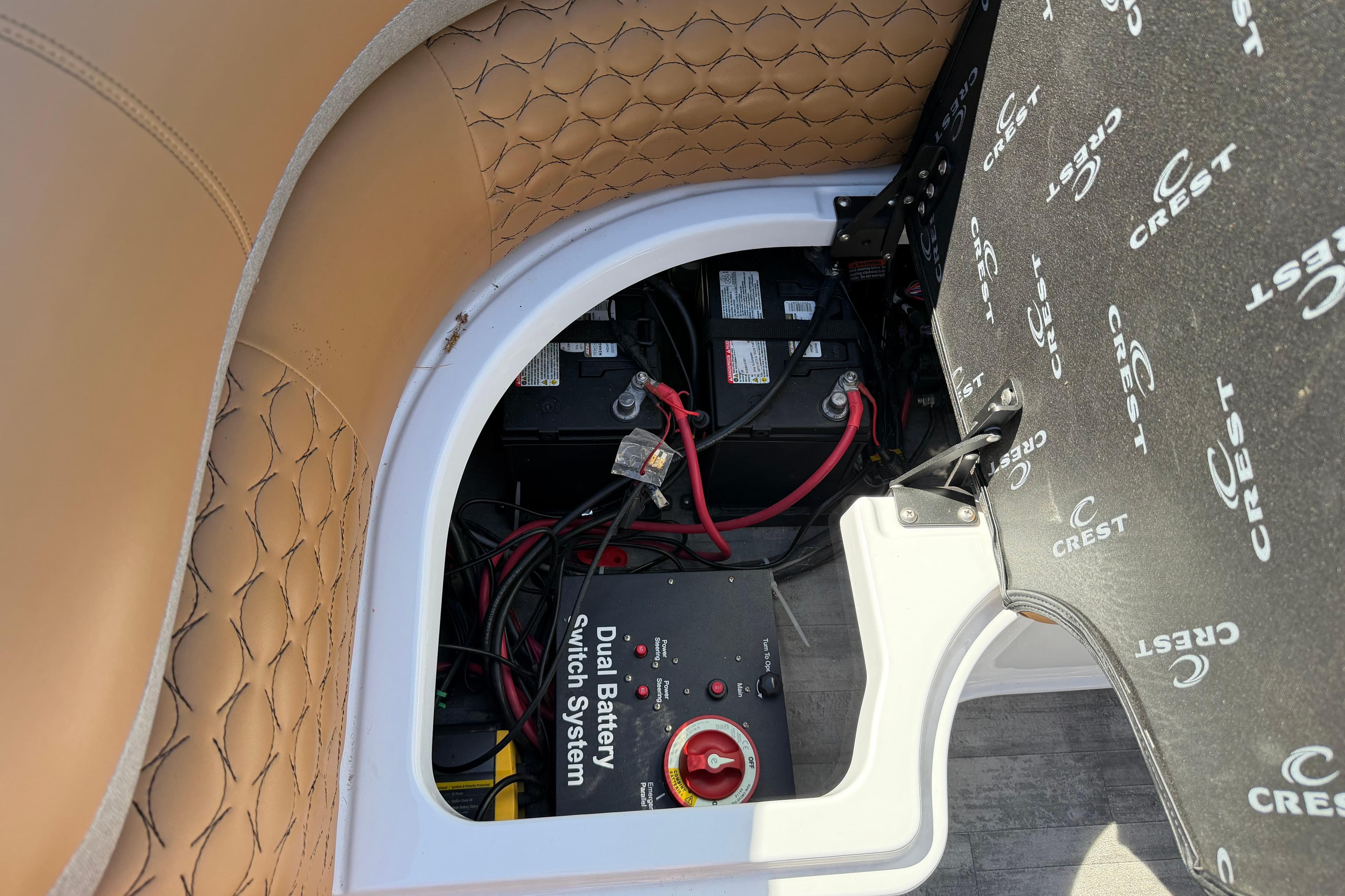 2022 Crest Savannah 250 SLC boat's dual battery switch system under seat.