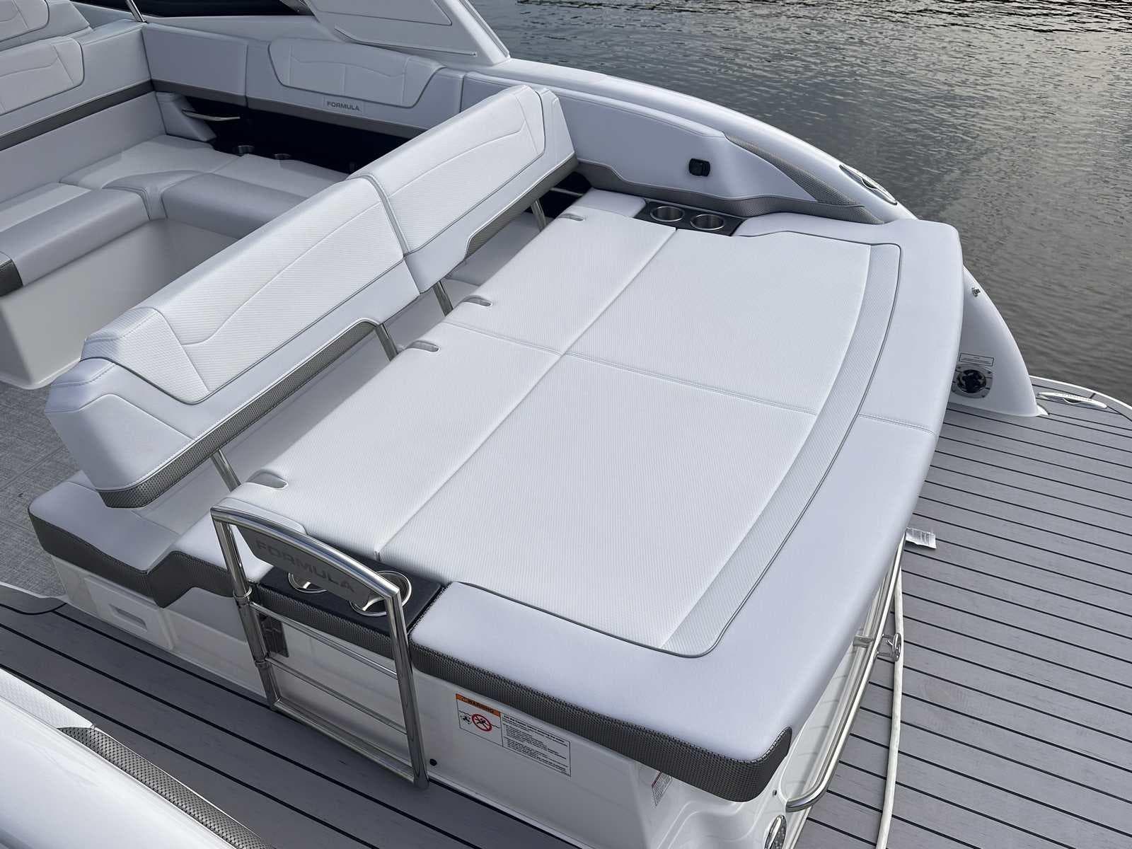 2025 Formula 350 Crossover Bowrider I/O with spacious white seating on deck.