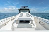 2023 Invincible 46' Catamaran Pilothouse on open sea, clear sky background.