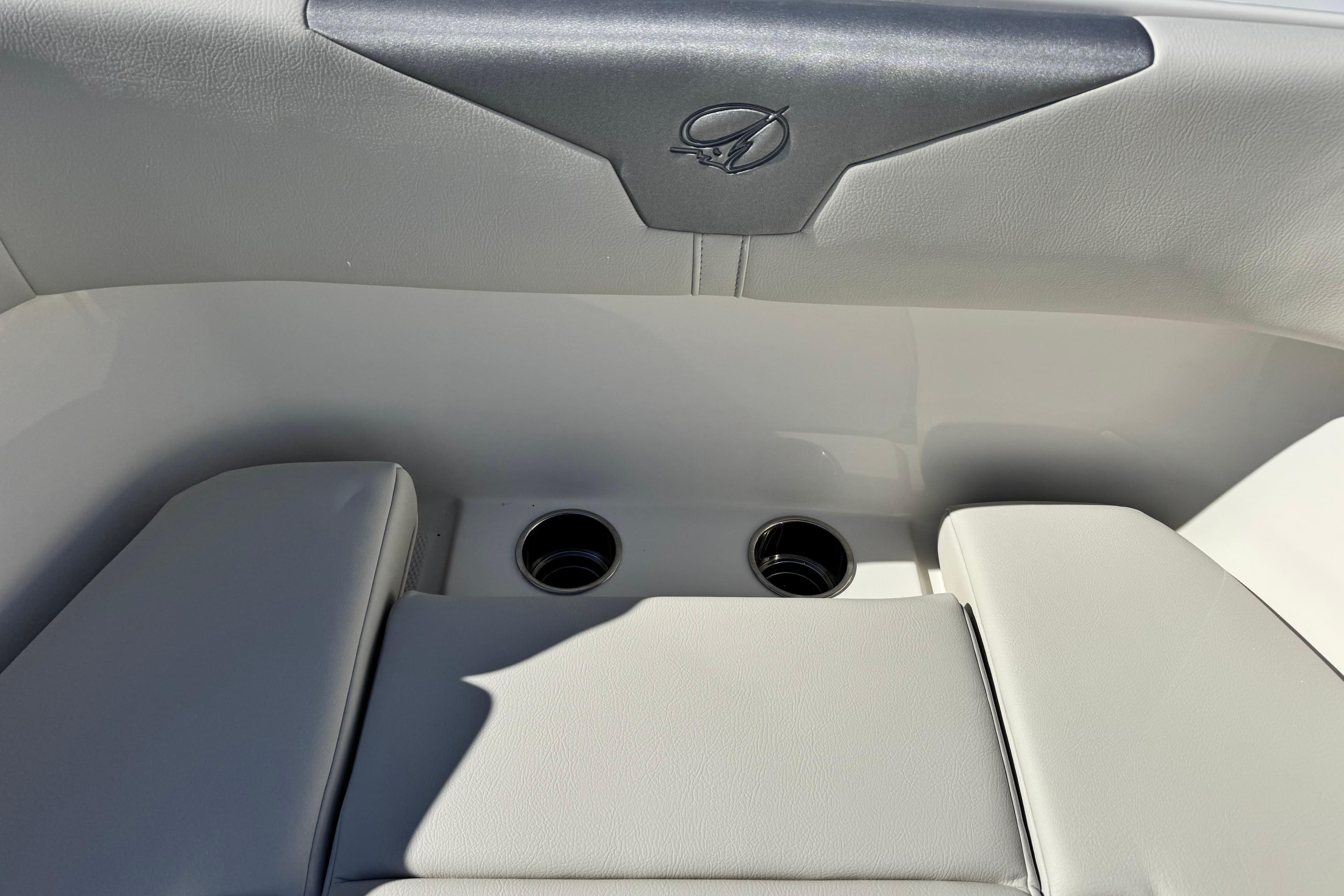 Interior seating of 2026 Sailfish 272 CC boat with cup holders.