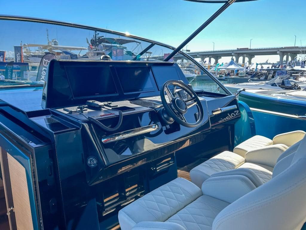 Helm of 2024 Solaris Power 52 Open yacht with luxurious seating and modern controls.