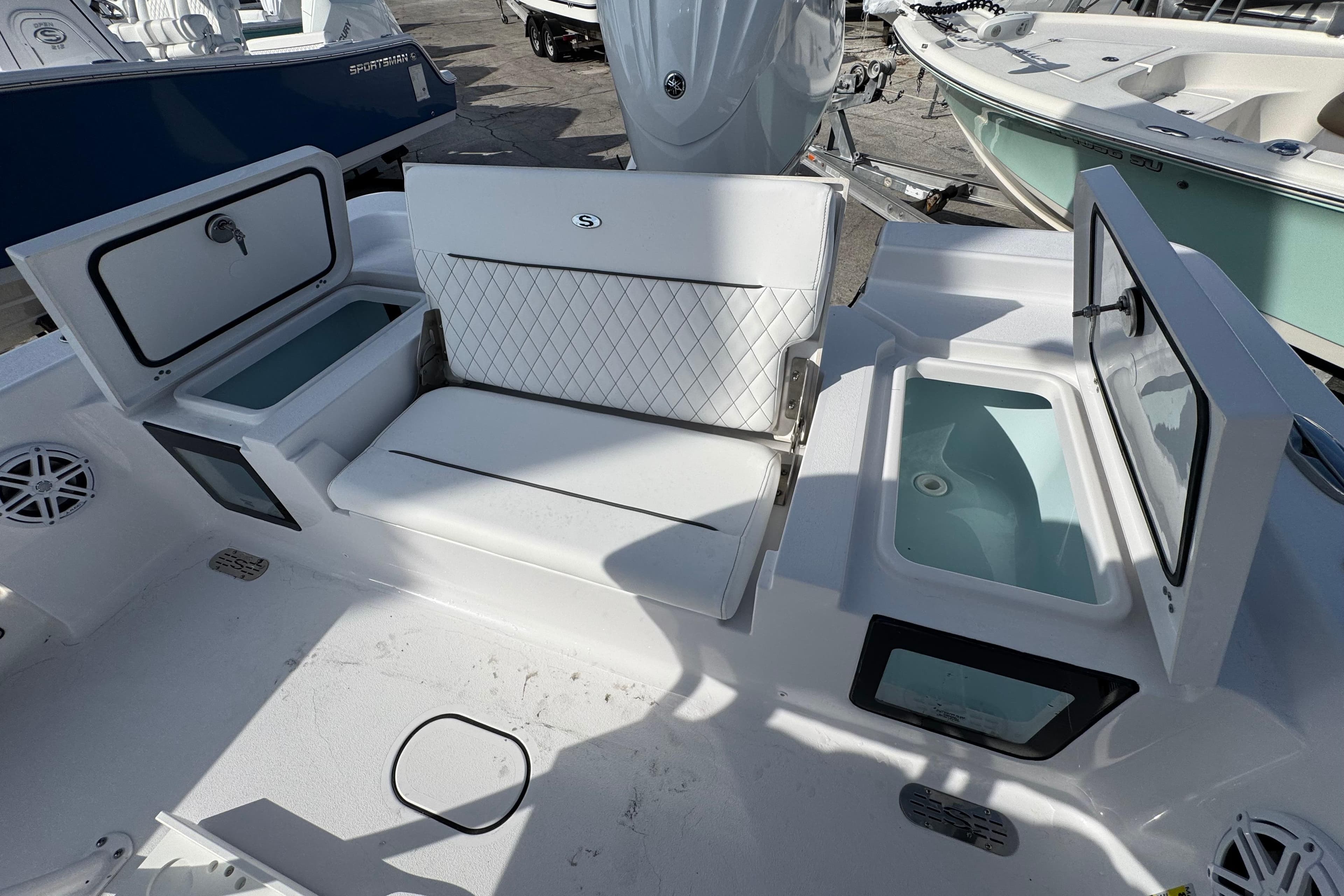 2026 Sportsman Masters 227 Bay Boat interior with seating and storage compartments.
