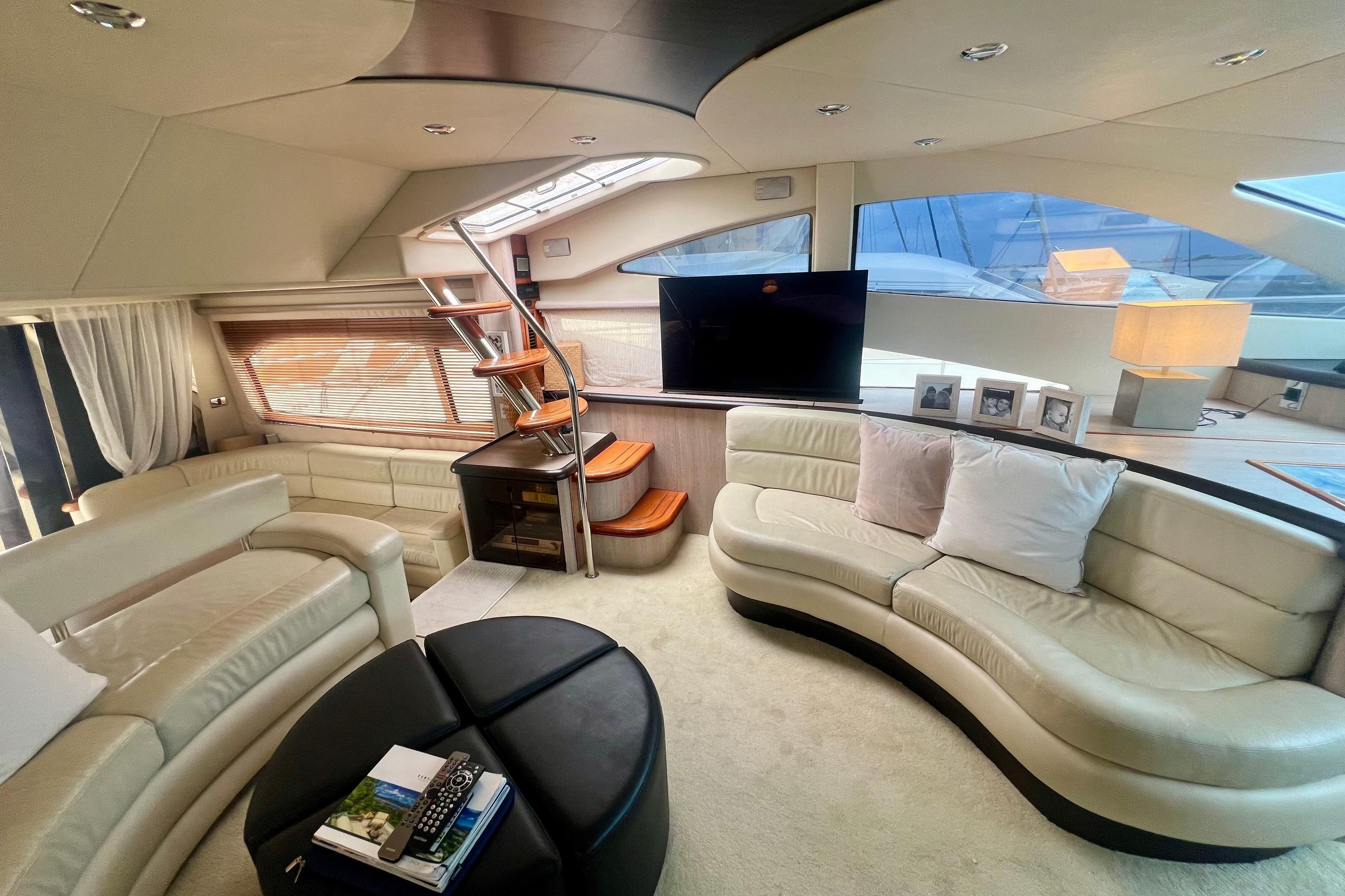 Luxurious interior of 2002 Sunseeker Manhattan 64 yacht with elegant seating and modern decor.