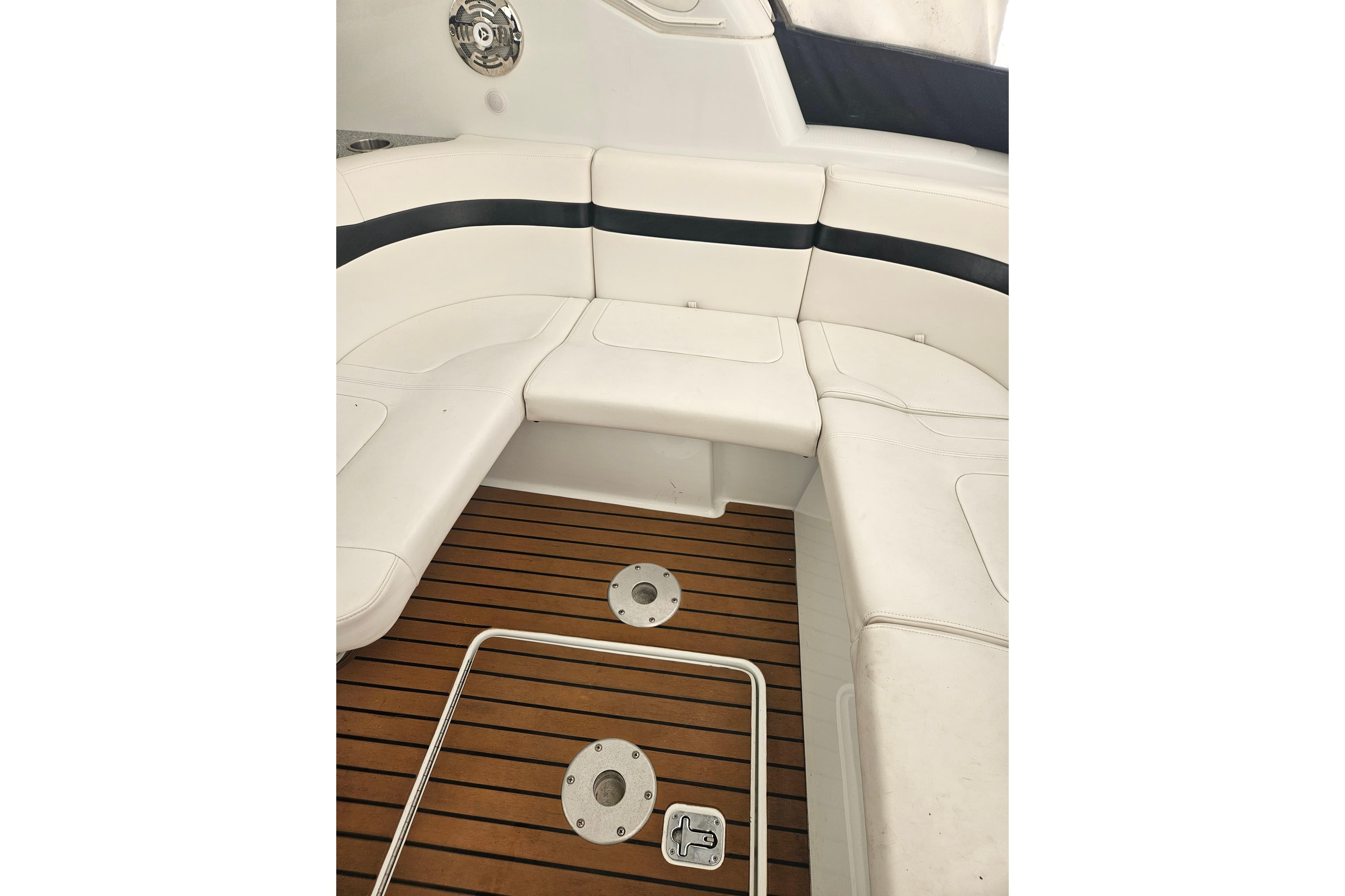 2010 Formula 34 Performance Cruiser interior with white seating and teak flooring.