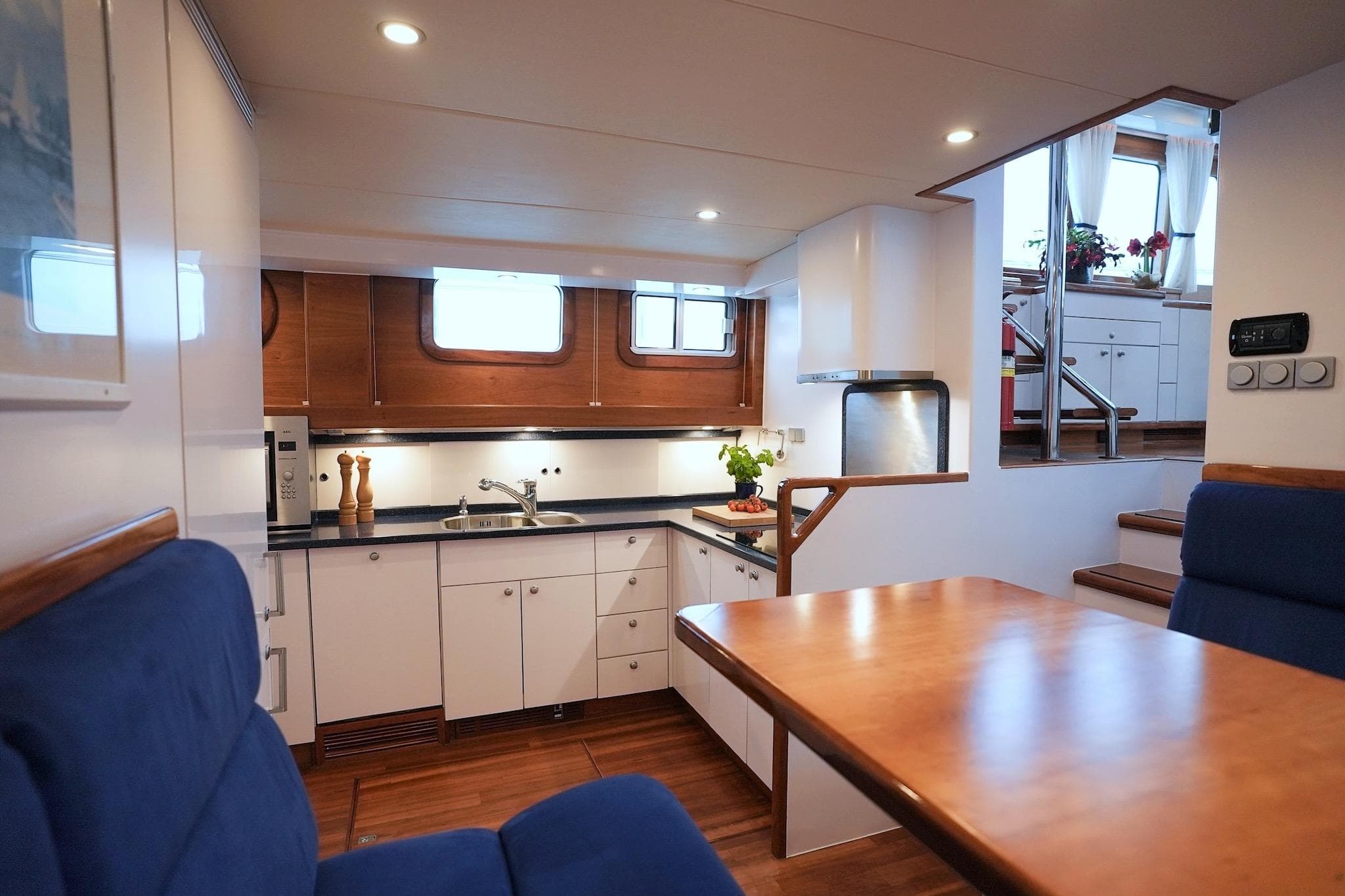 Luxurious yacht interior with modern kitchen and dining area, Stentor 1800, 2005 model.