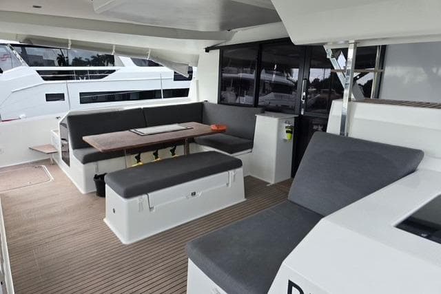 2022 Fountaine Pajot Tanna 47 yacht interior with modern seating and dining area.