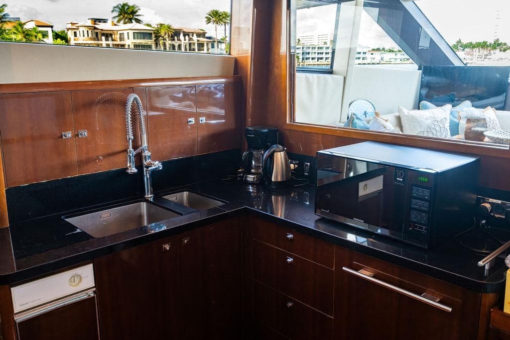 Luxurious kitchen on a 2010 Princess 95 Motor Yacht with modern appliances.