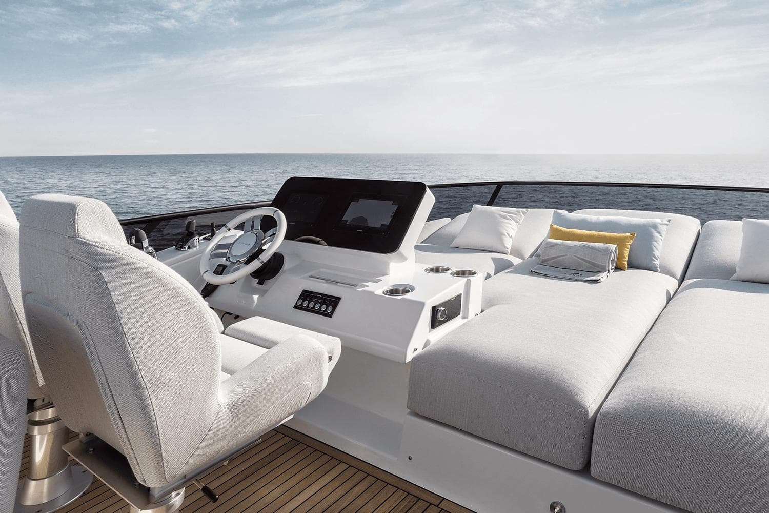 2024 Azimut 53 Fly yacht helm and sunbathing area with ocean view.