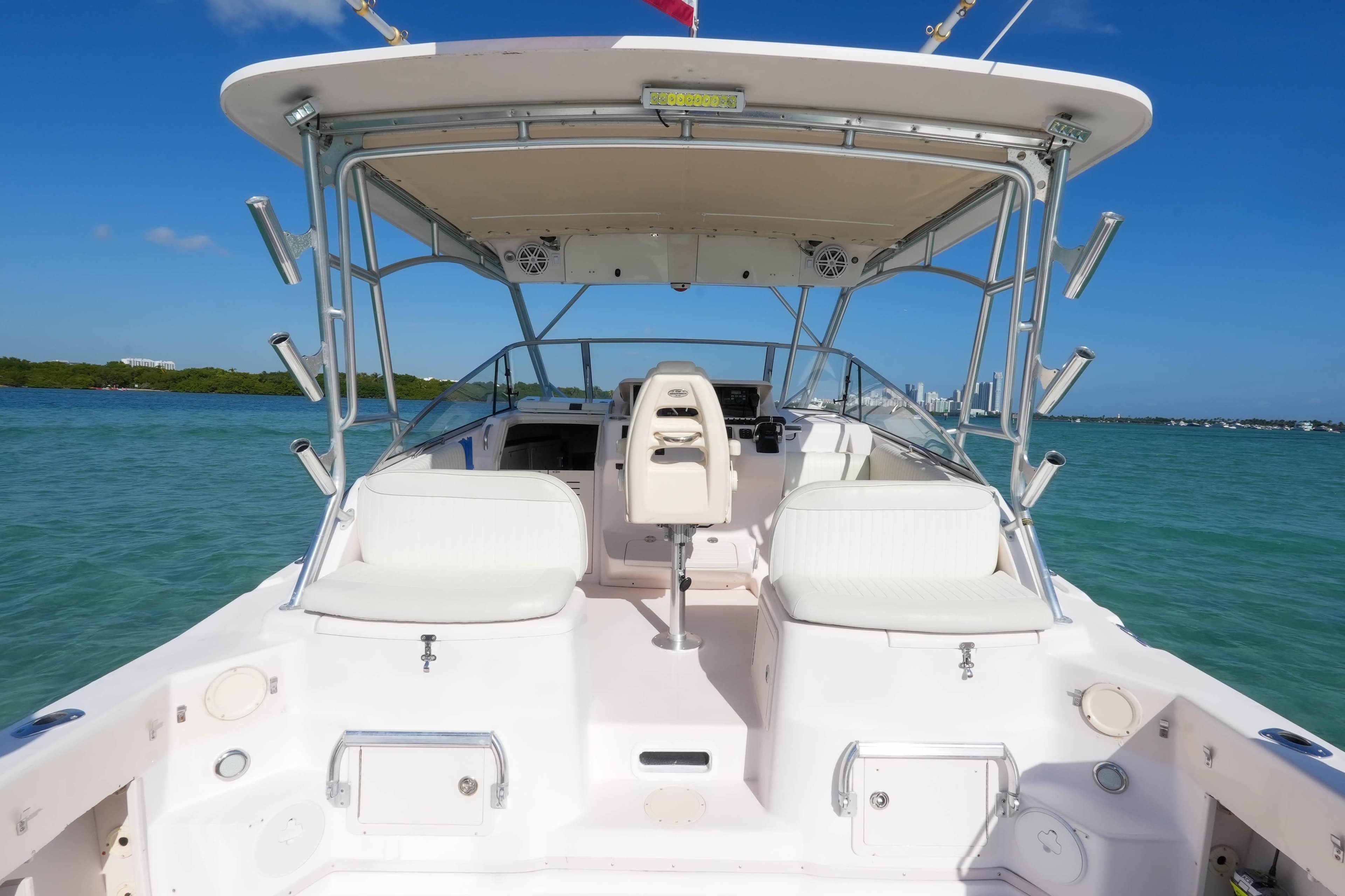 2003 Grady-White Express 330 boat interior with seating, ocean view, and clear blue sky.