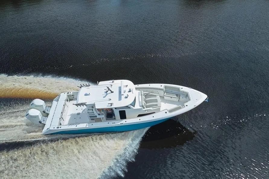 2022 Solace 41 CS boat cruising on open water, aerial view.