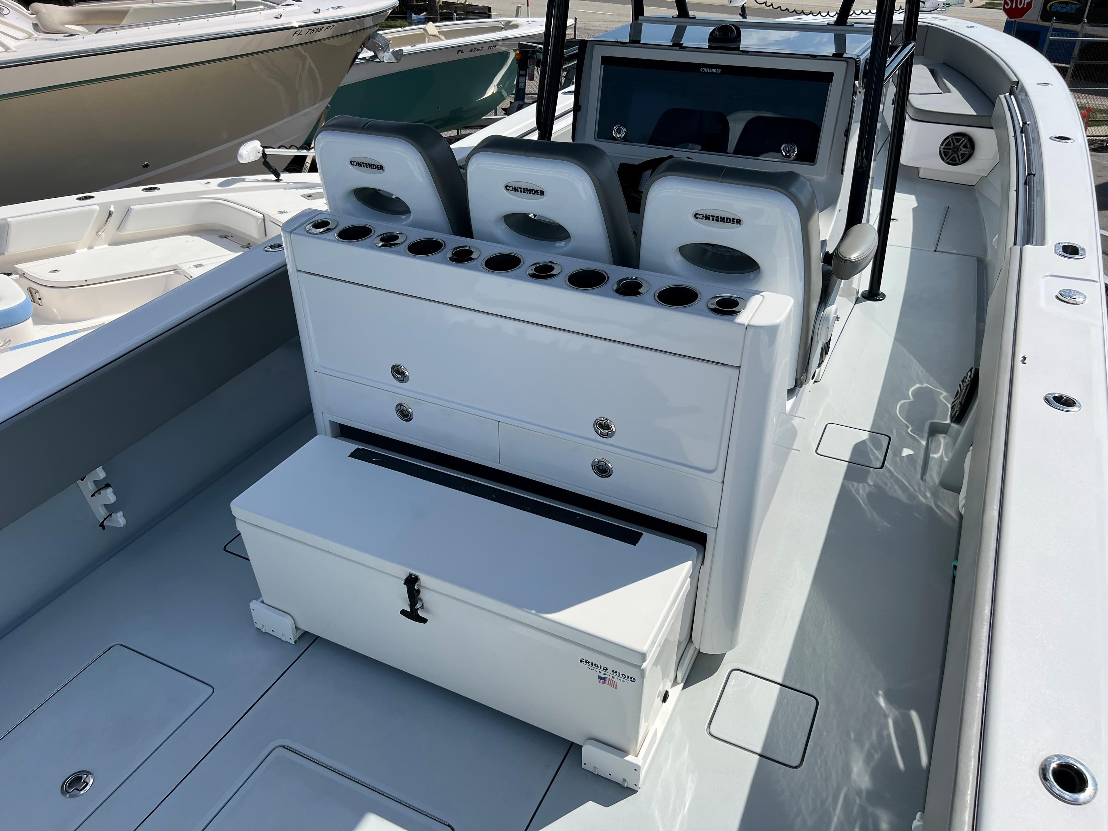 Interior view of a 2018 Contender 39 ST boat with seating and storage.