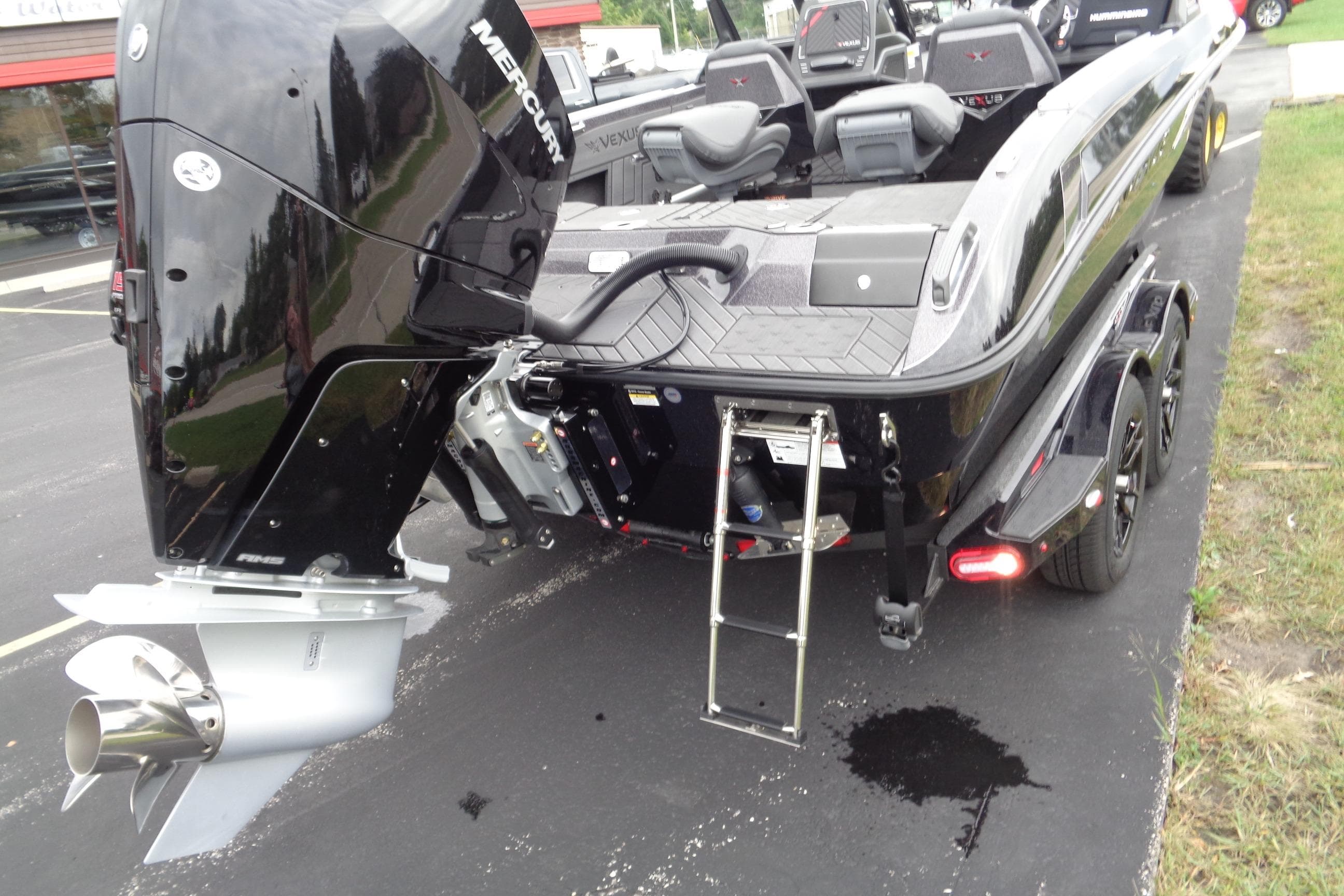 2026 Vexus DVX22S boat with Mercury engine, rear view on trailer.