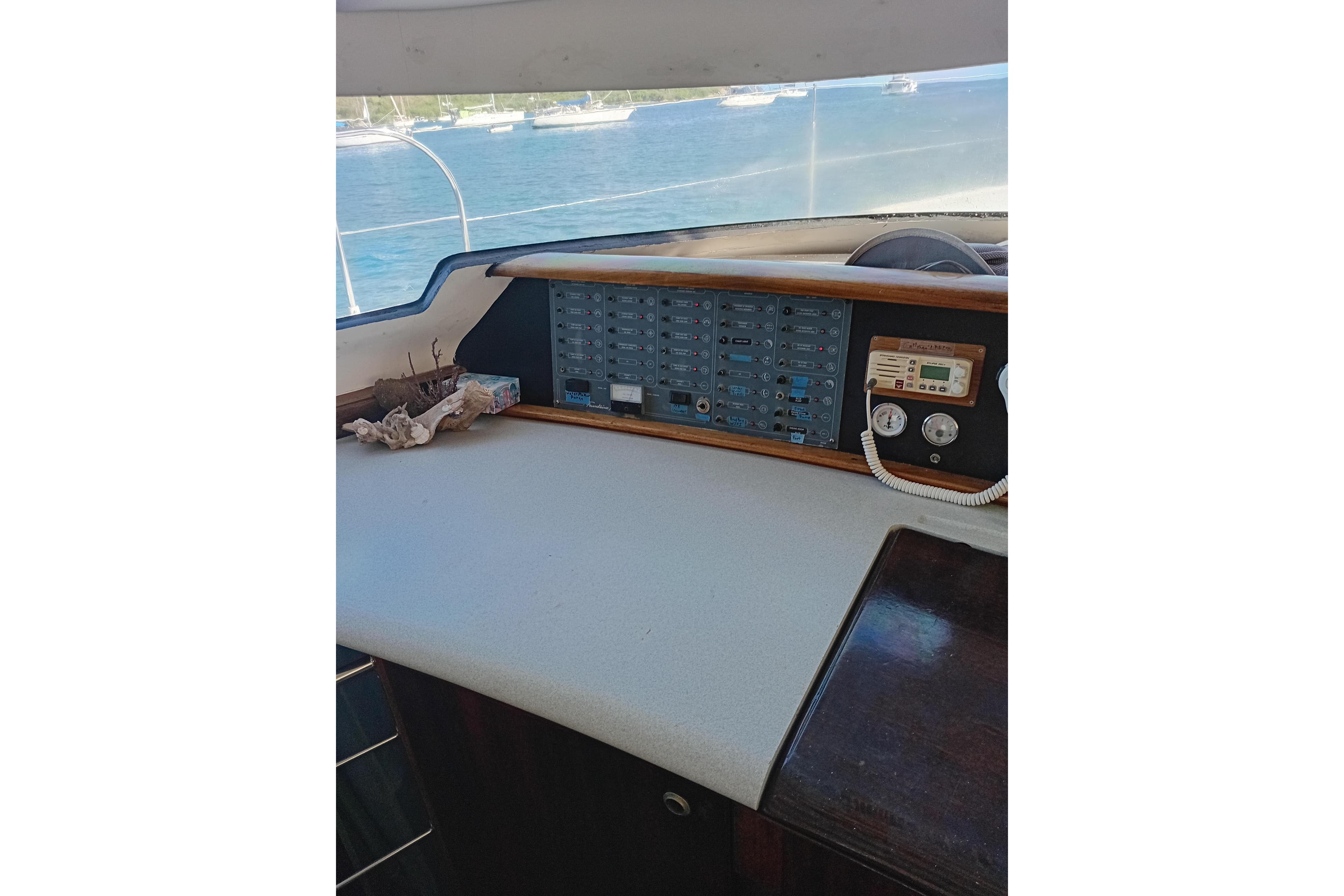 Control panel of 1995 Fountaine Pajot Marquises 56 catamaran with ocean view.