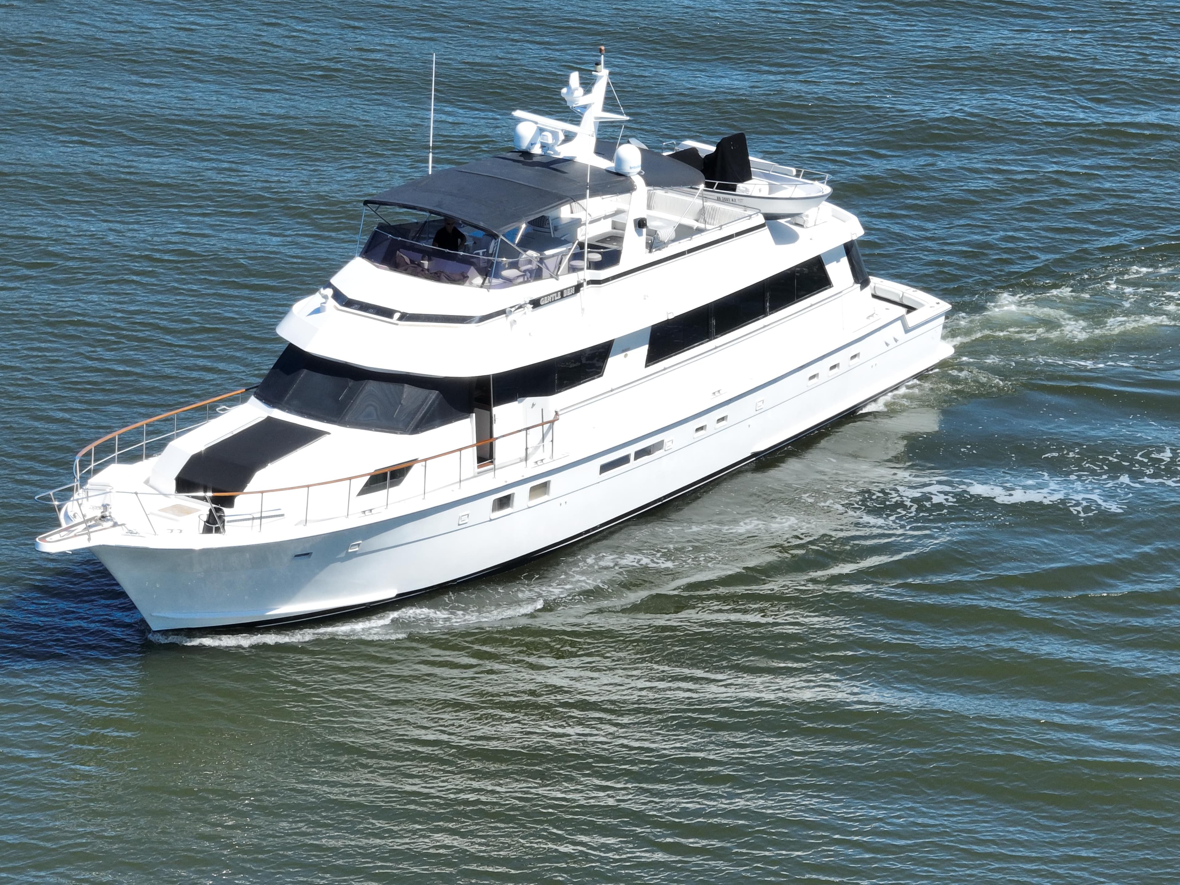 1989 Hatteras 80 Cockpit Motor Yacht cruising on open water.