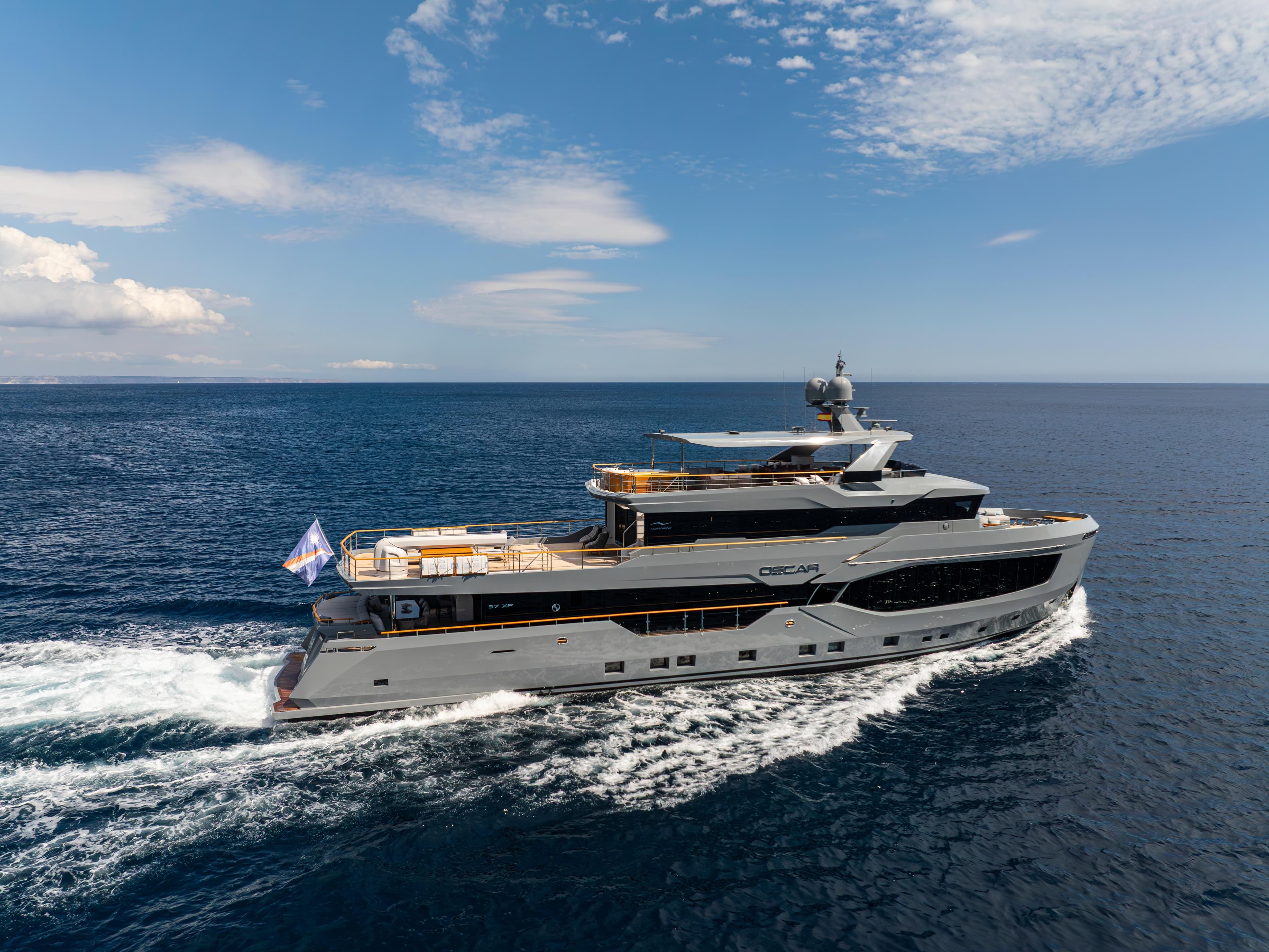 2023 Numarine 37XP yacht cruising on open sea under clear skies.