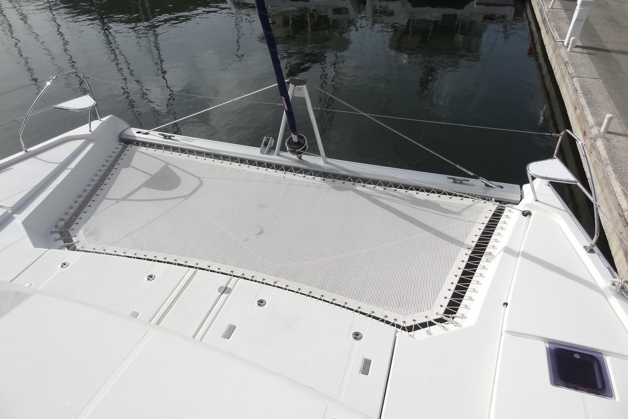 Leopard 50 catamaran deck with netting, docked at marina, 2021 model.