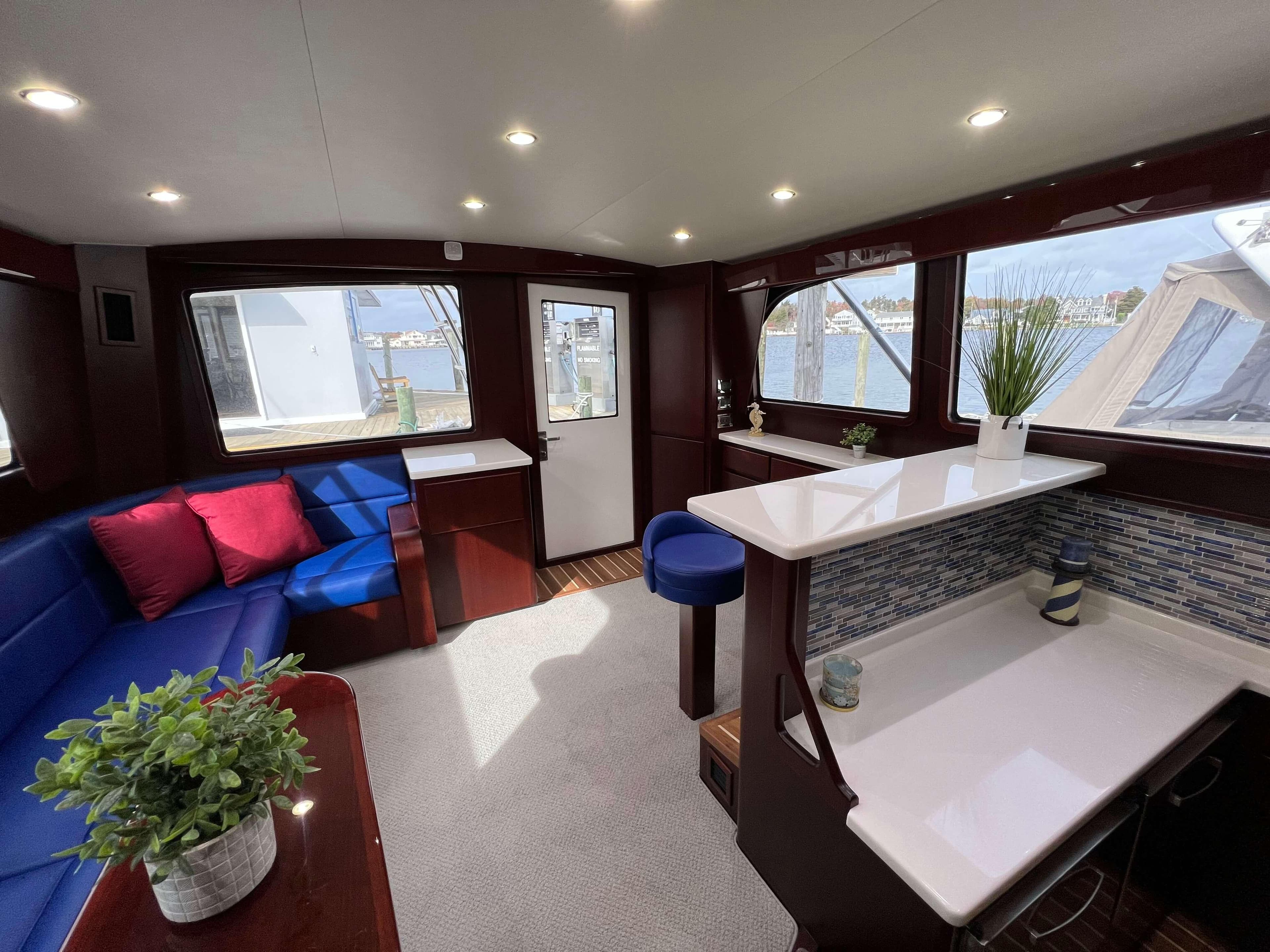 Interior of 2025 Henriques 42 Flybridge yacht with modern seating and decor.