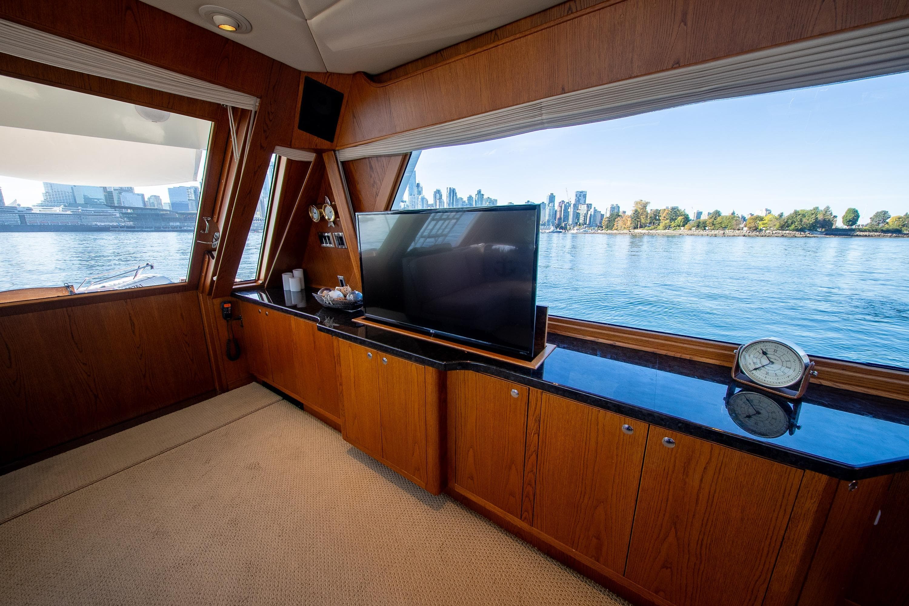 Luxurious interior of 1988 Philbrooks Pilot House Motor Yacht with waterfront view.