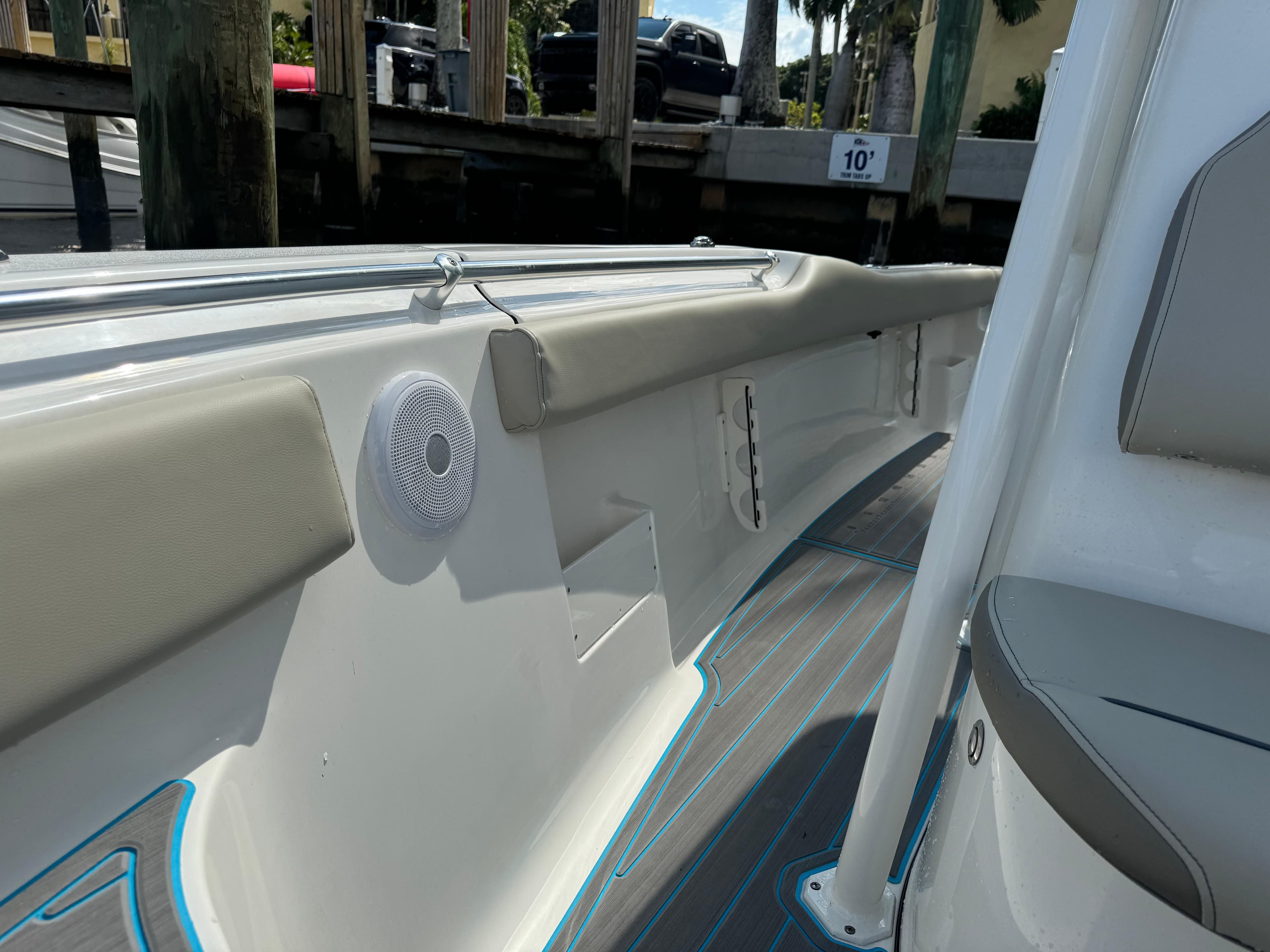 2024 Key West 239 FS boat interior with cushioned seating and speaker.