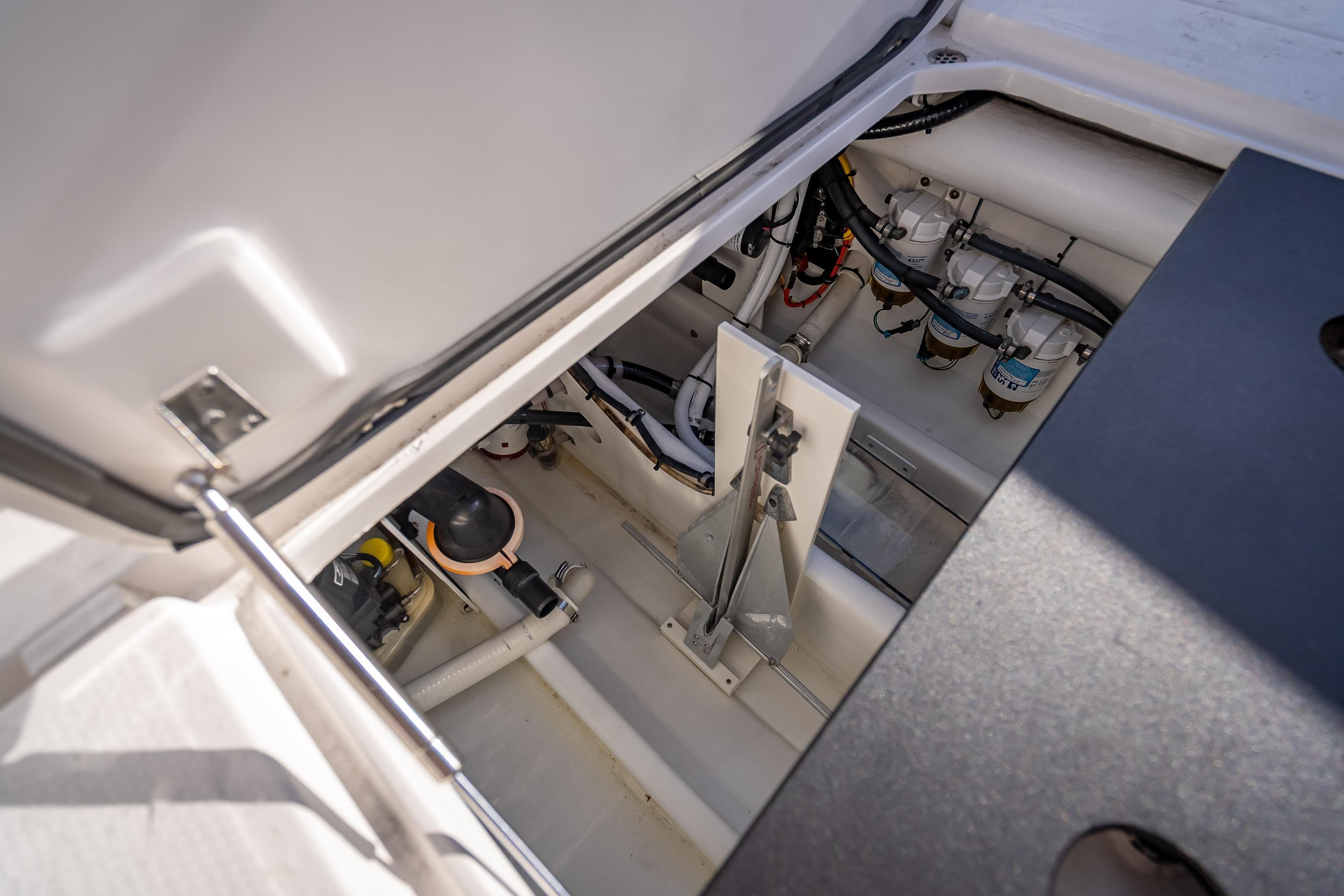 2015 Nor-Tech 340 Sport Center Console engine compartment with visible components and wiring.