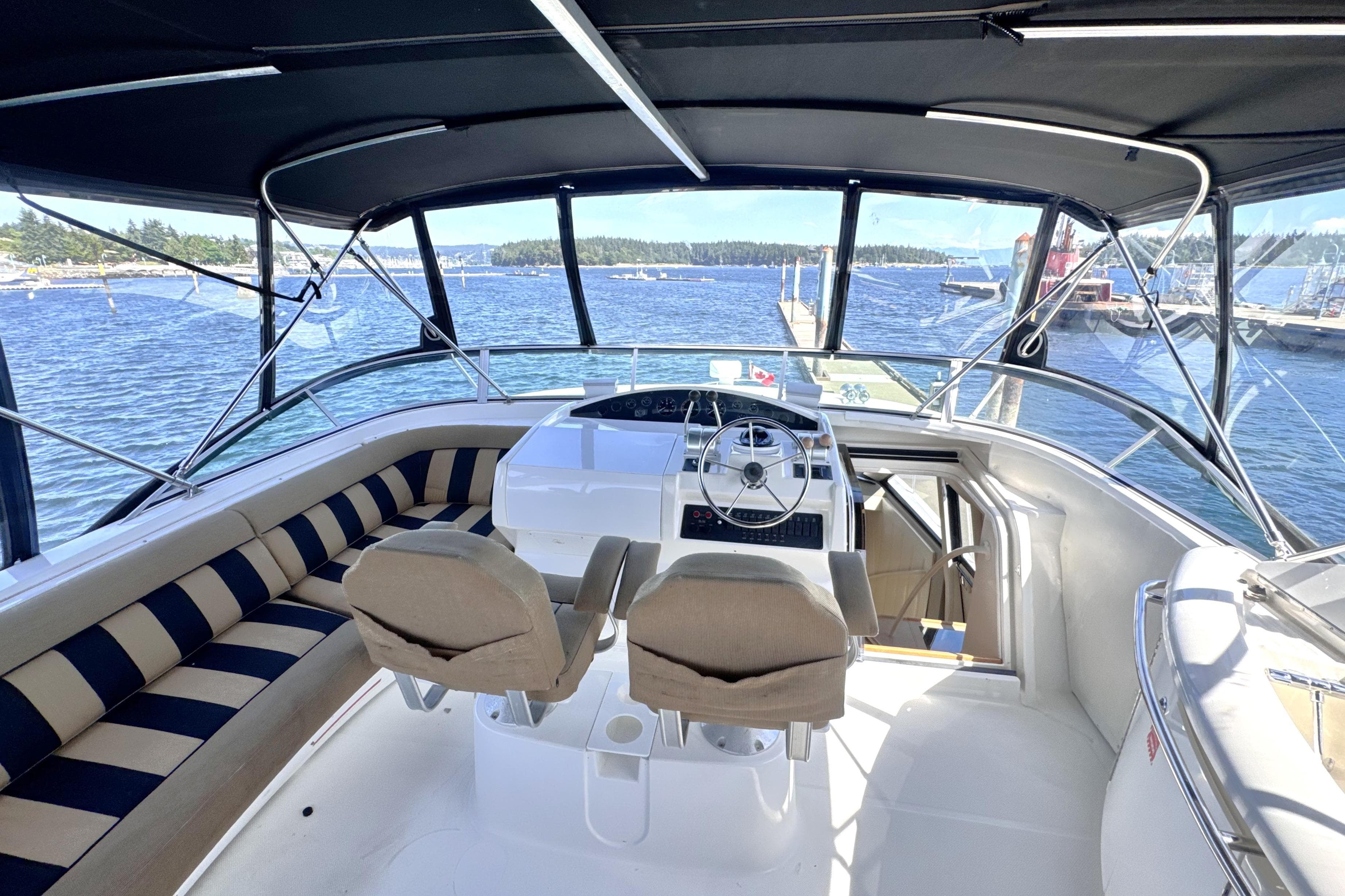 2000 Bayliner 5788 Pilot House Motoryacht helm with panoramic water view.