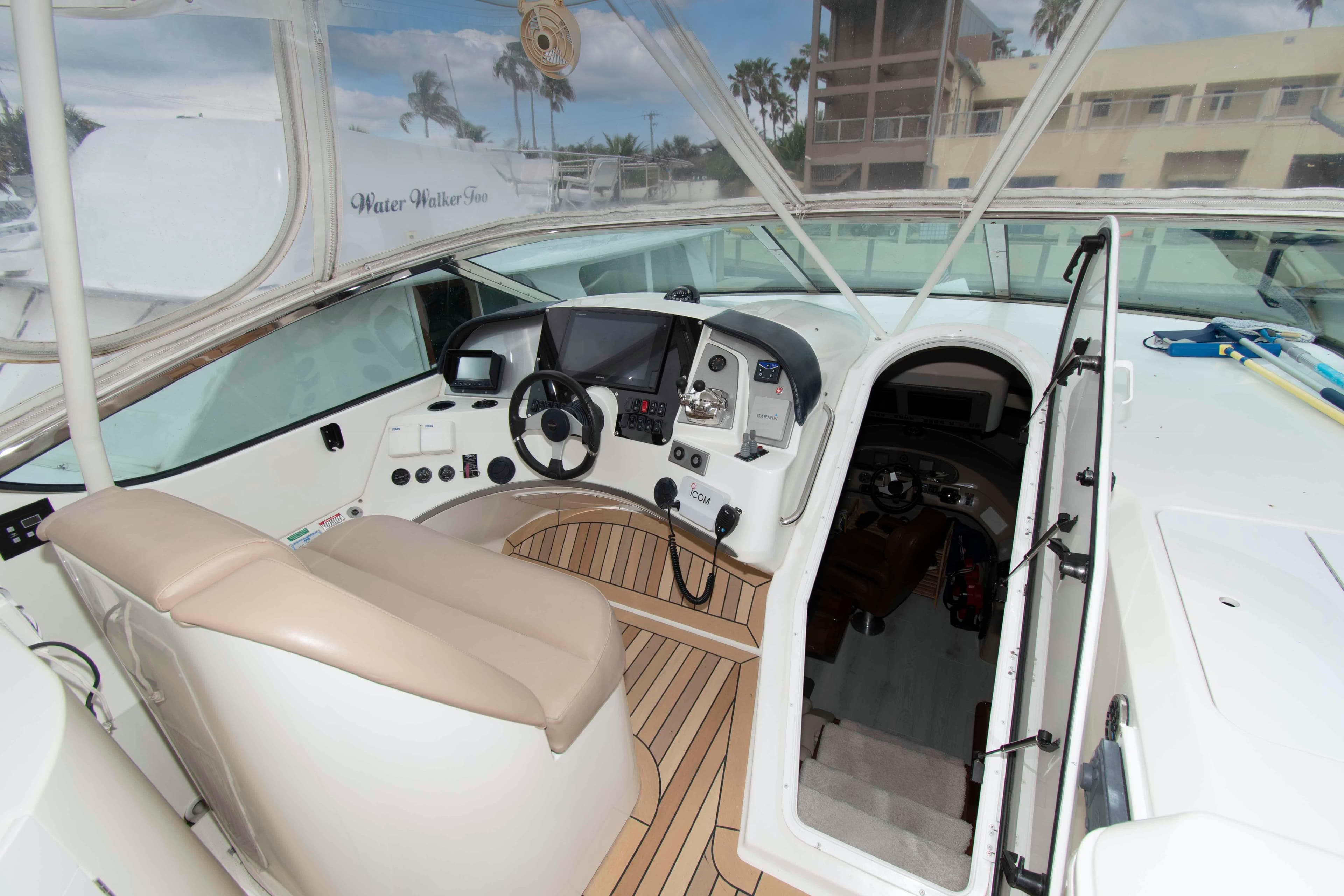 Interior view of 2007 Carver 56 Voyager yacht cockpit with modern navigation equipment.