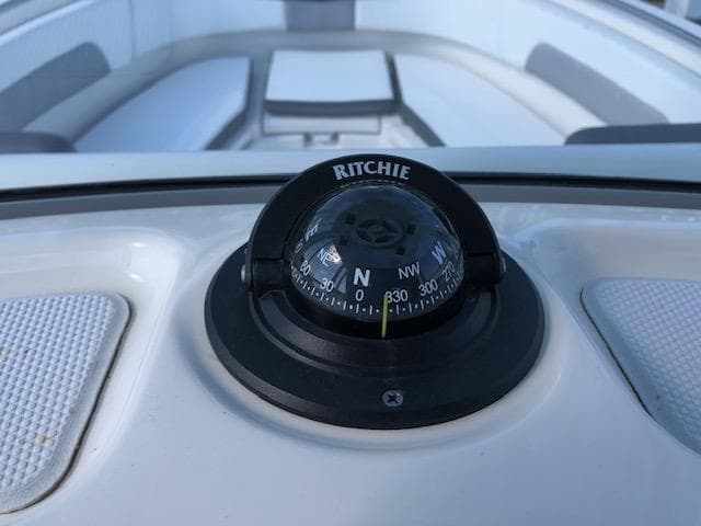 Ritchie compass on 2022 Robalo R242 Center Console boat dashboard.