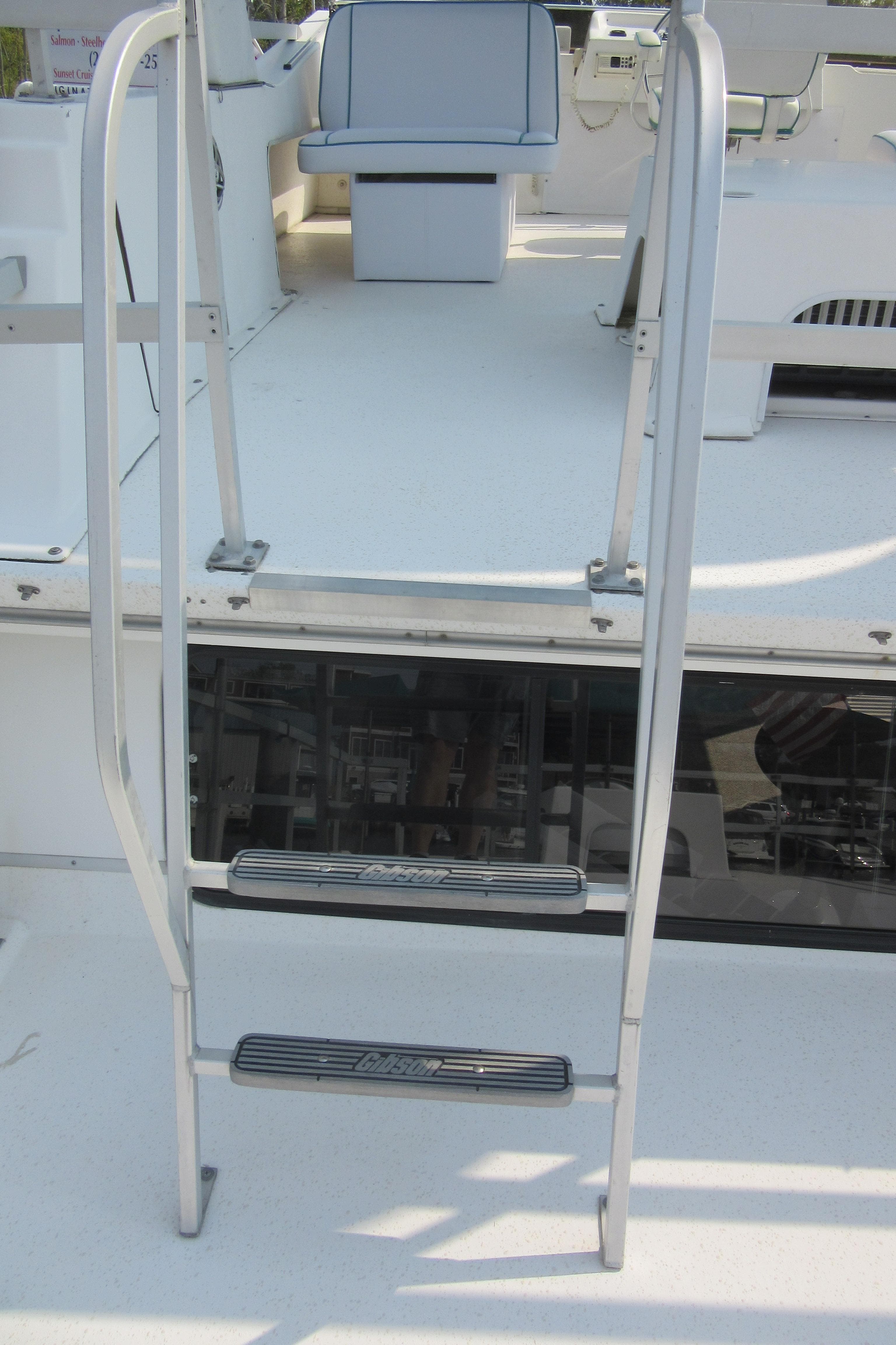 Metal ladder on a 1995 Gibson 44 Classic boat deck.