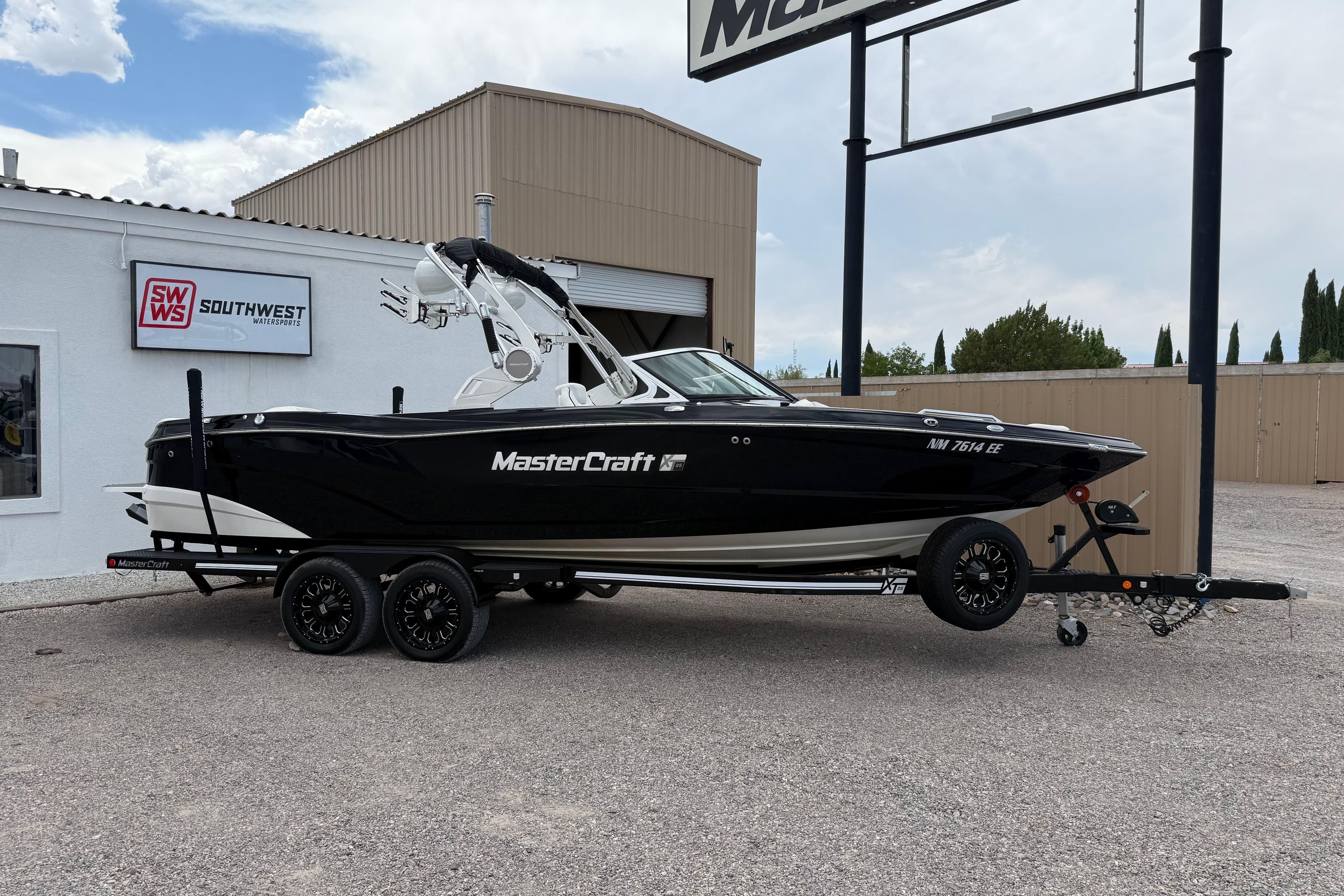 2018 MasterCraft XT25 boat on trailer at Southwest dealership.
