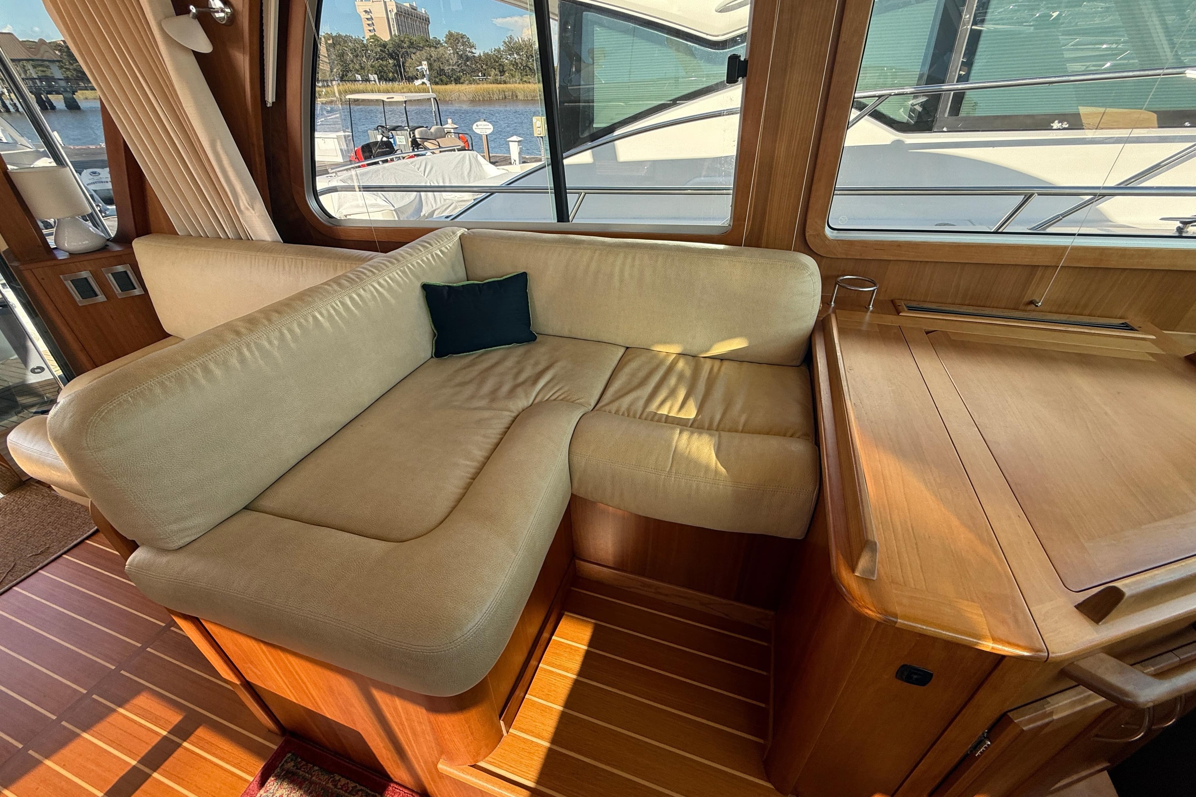 Interior of 2017 Sabre 48 Salon Express with beige seating and wooden accents.