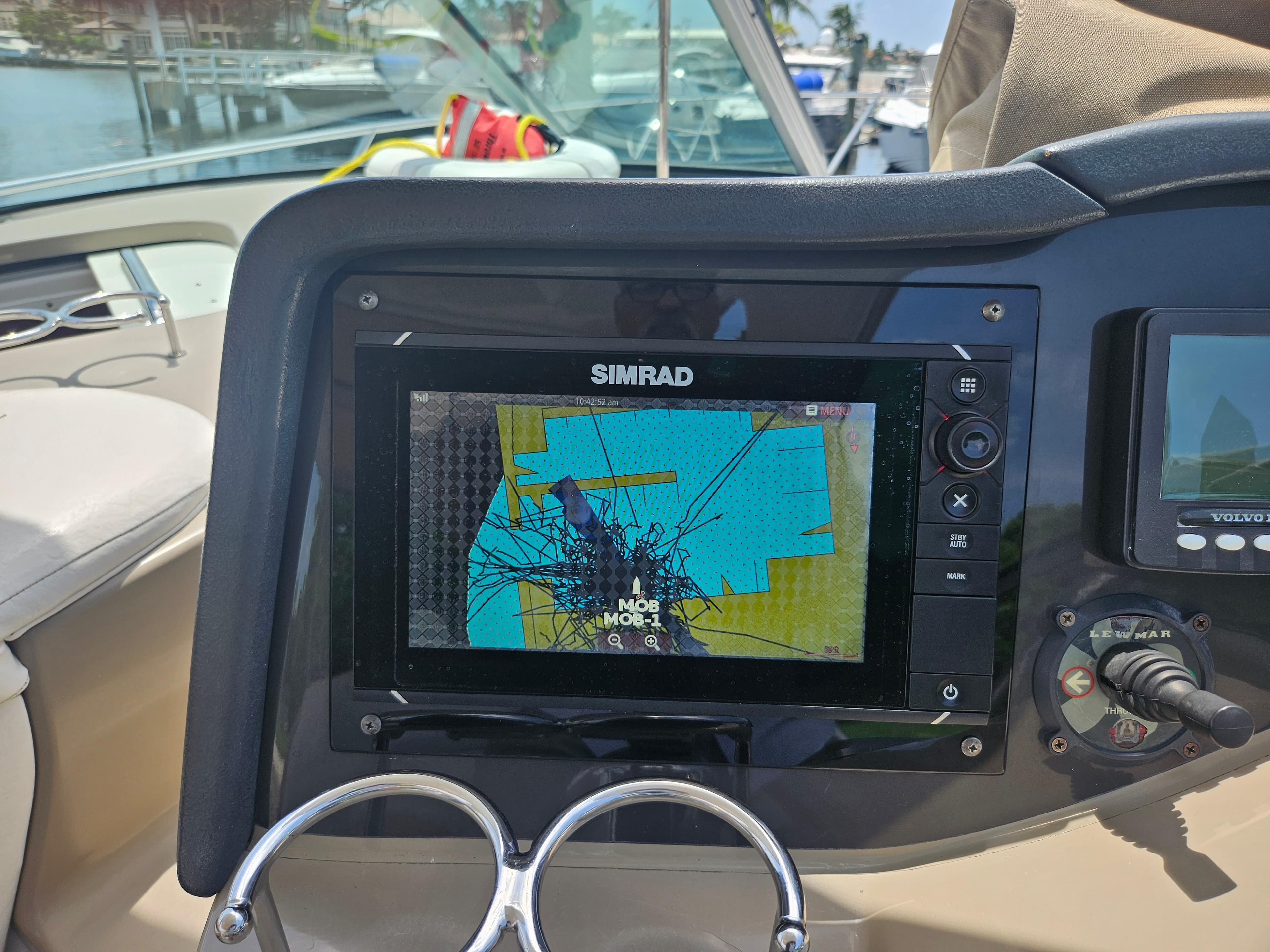 Simrad navigation system on 2005 Four Winns 378 Vista boat dashboard.