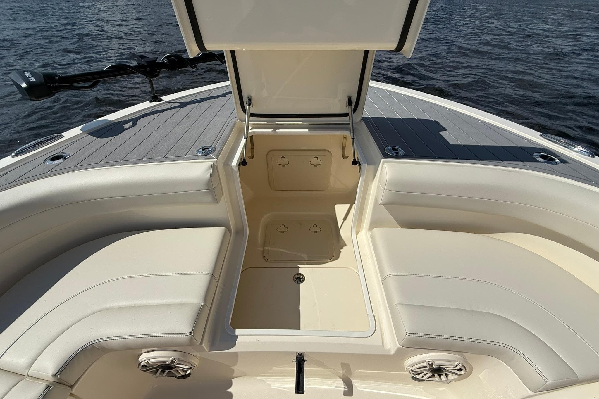 2026 Scout 281 XSS boat interior with open storage compartment and cushioned seating.