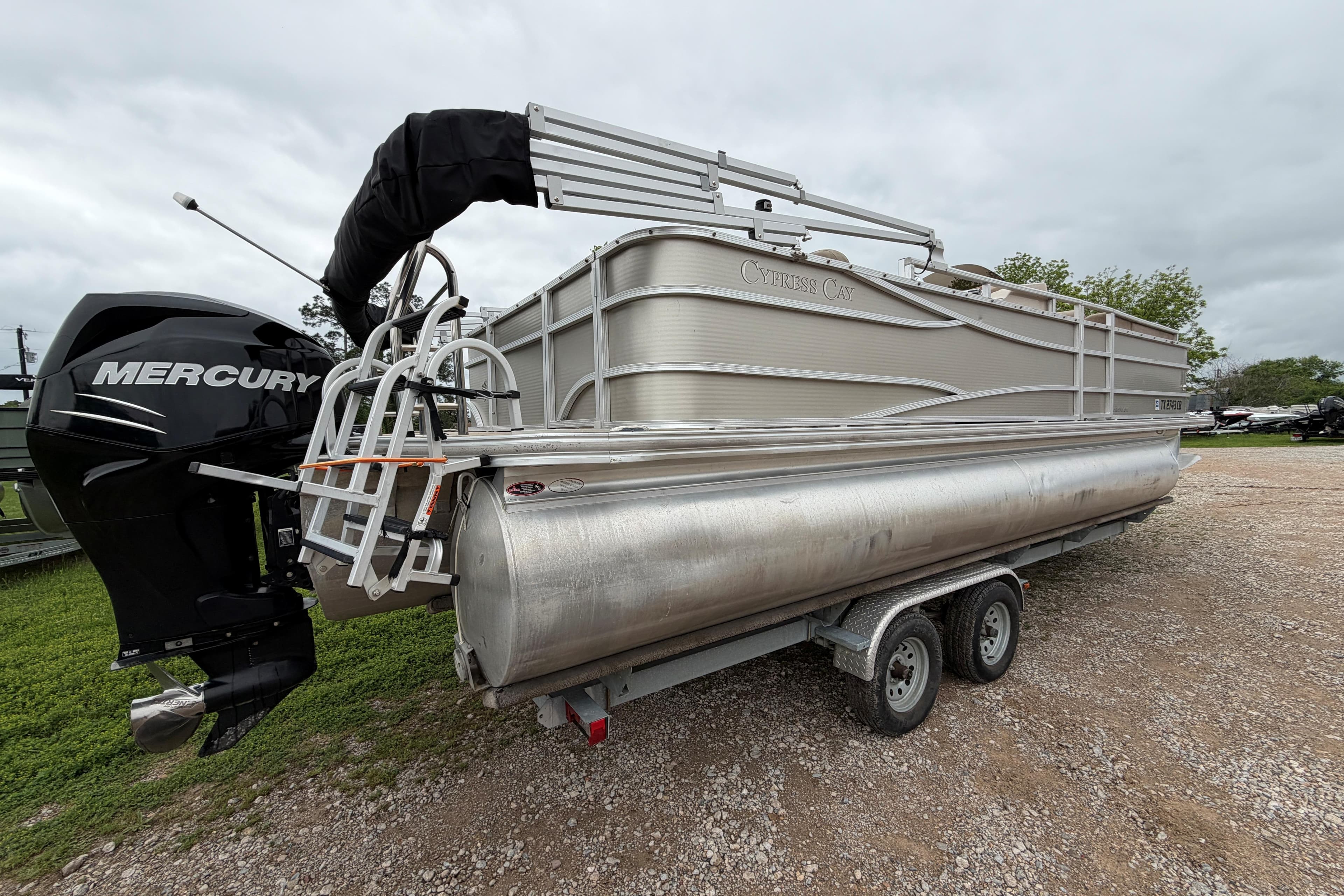 2013 Cypress Cay Cabana 240 pontoon boat with Mercury engine on a trailer.