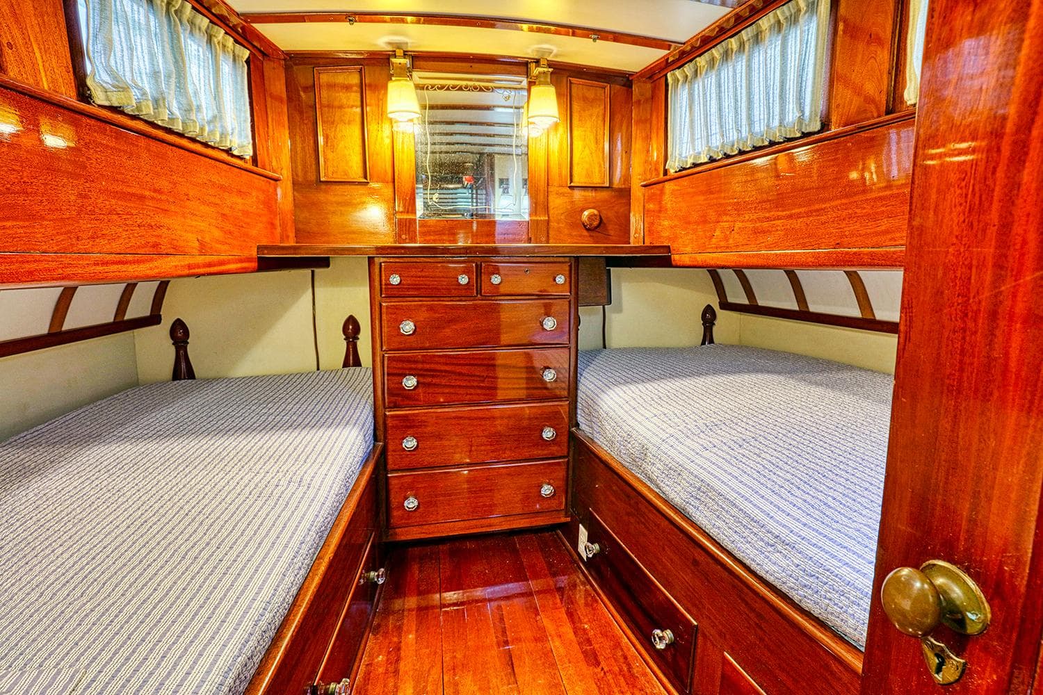 1926 Hacker-Craft Bridge Deck interior with wooden furnishings.