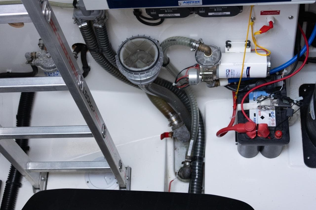 Engine compartment of 2023 Fountaine Pajot Samana 59 with battery and wiring.