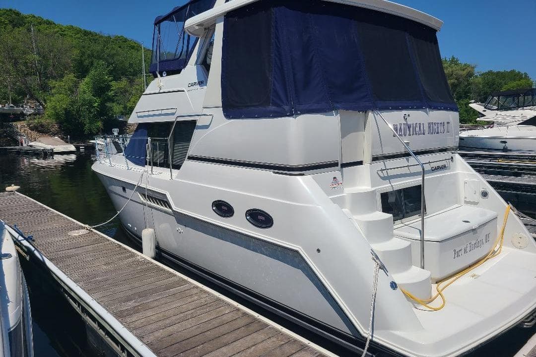 2003 Carver 356 Aft Cabin Motor Yacht docked at a marina.