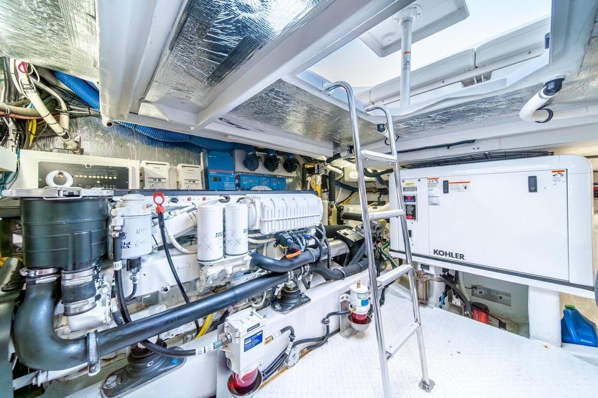 Engine room of 2017 Cruisers Yachts 45 Cantius with Kohler generator and ladder.