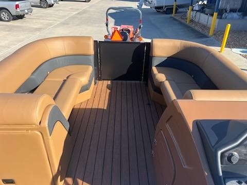 2025 Bentley Pontoons 223 Elite Swingback Dual Captain interior with tan and gray seating.