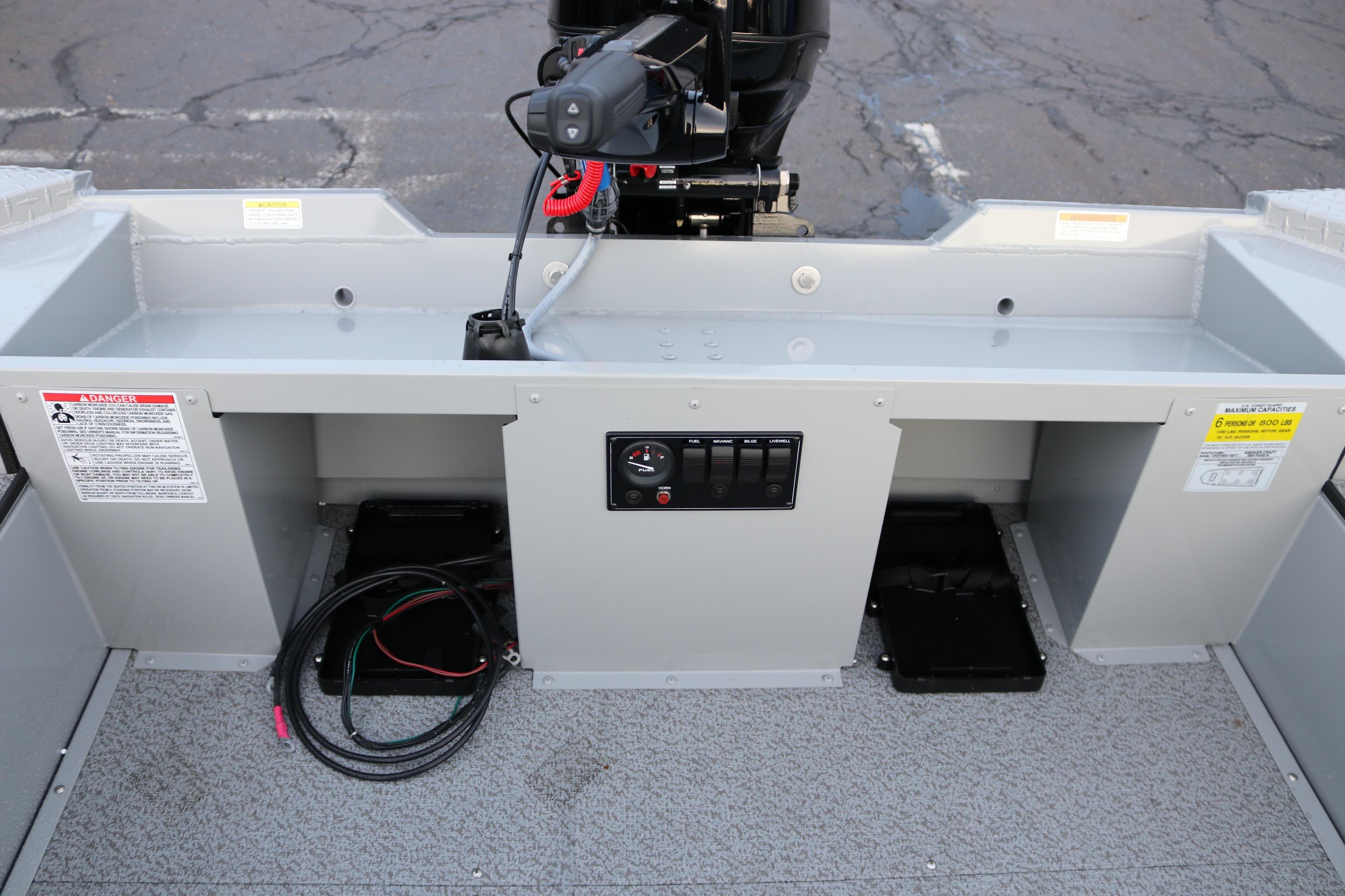 2026 Smoker Craft Sportsman 1660 boat interior with motor and control panel.