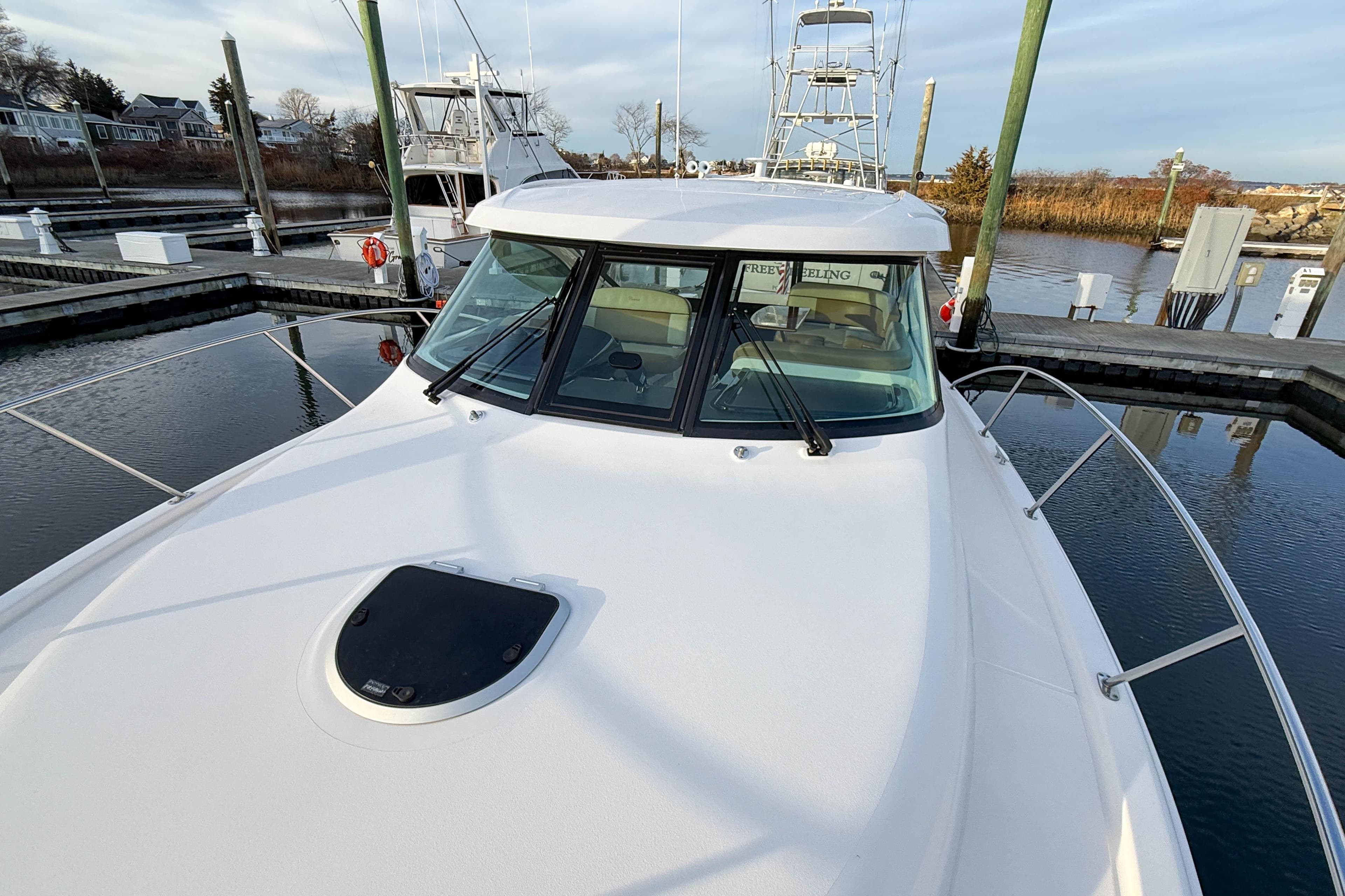 2013 Tiara Yachts 3600 Coronet docked, showcasing sleek design and spacious deck.