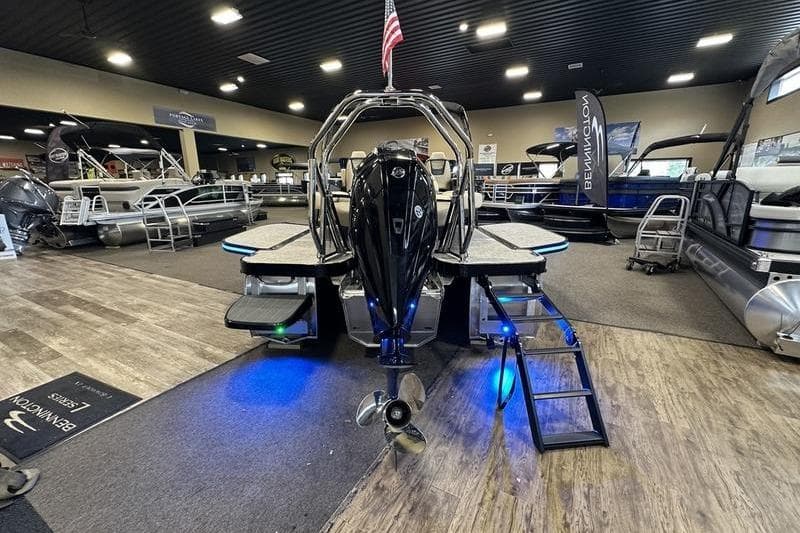 2026 Flamingo Rove 24' boat displayed in a showroom with modern design and lighting.
