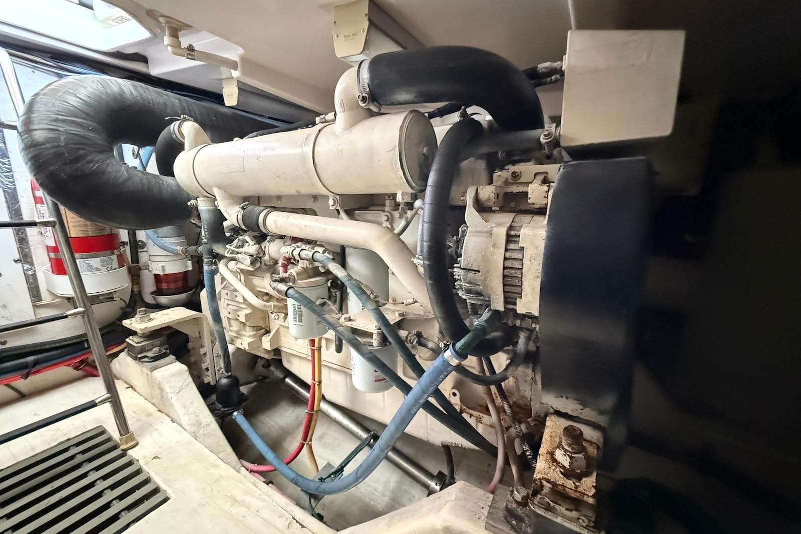 Engine room of 2004 Tiara Yachts 3600 Sovran, showcasing detailed mechanical components.