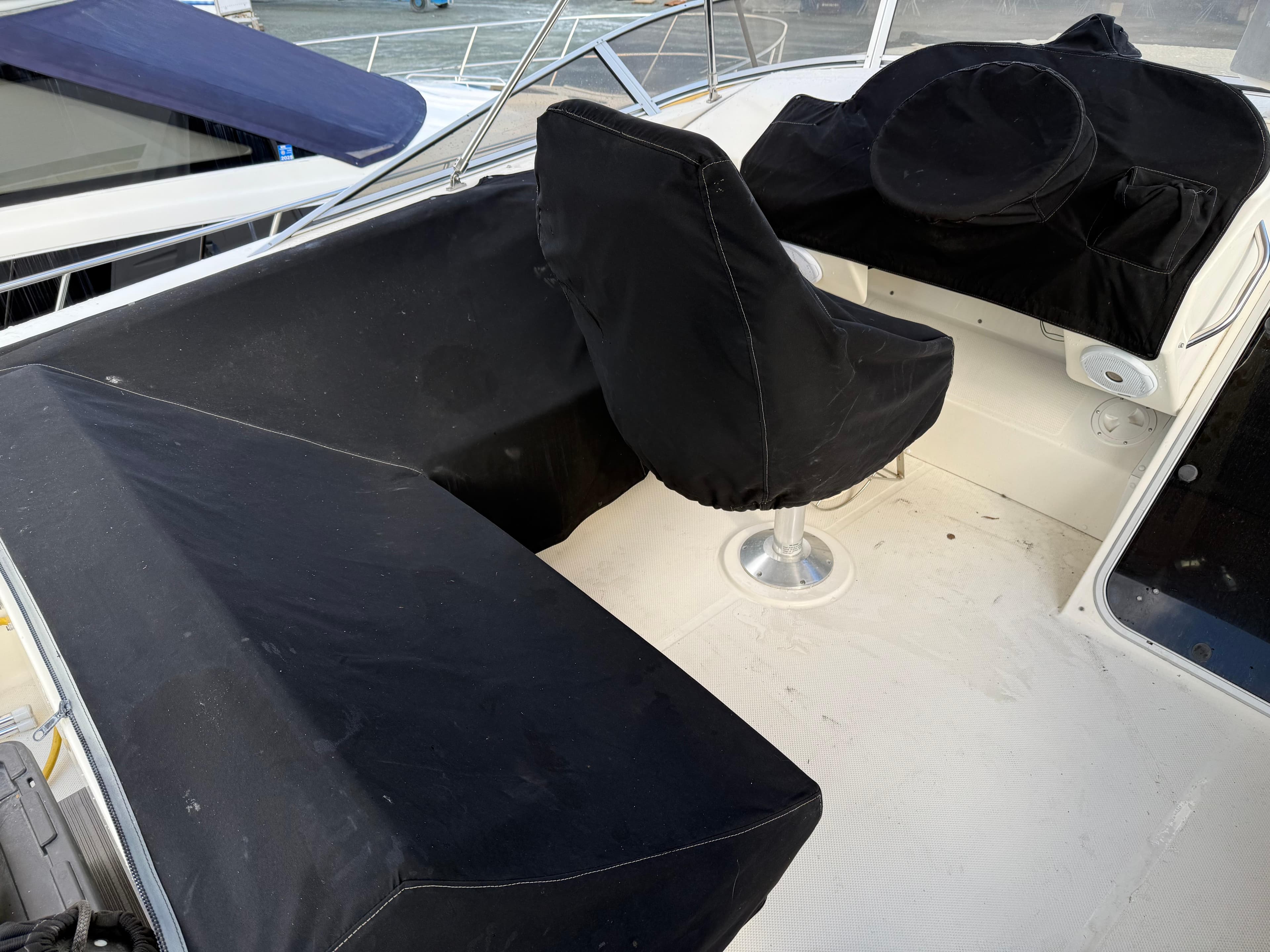 2003 Meridian 490 Pilothouse boat interior with black seat covers.