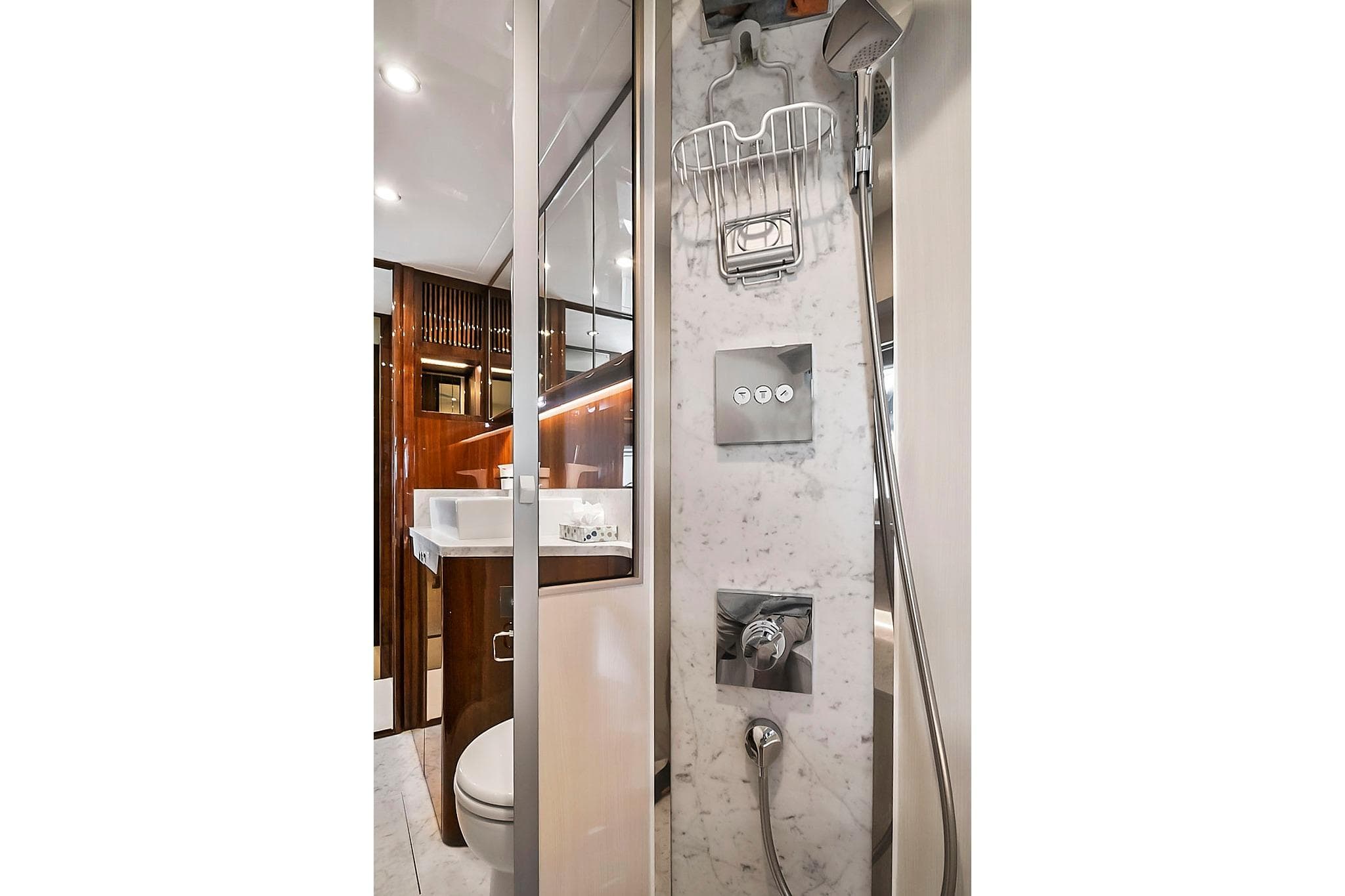 Luxurious bathroom in 2021 Fairline Squadron 68 yacht with marble shower and modern fixtures.