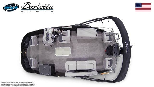 Top view of 2025 Barletta Boats A22F pontoon with seating and helm, American flag displayed.