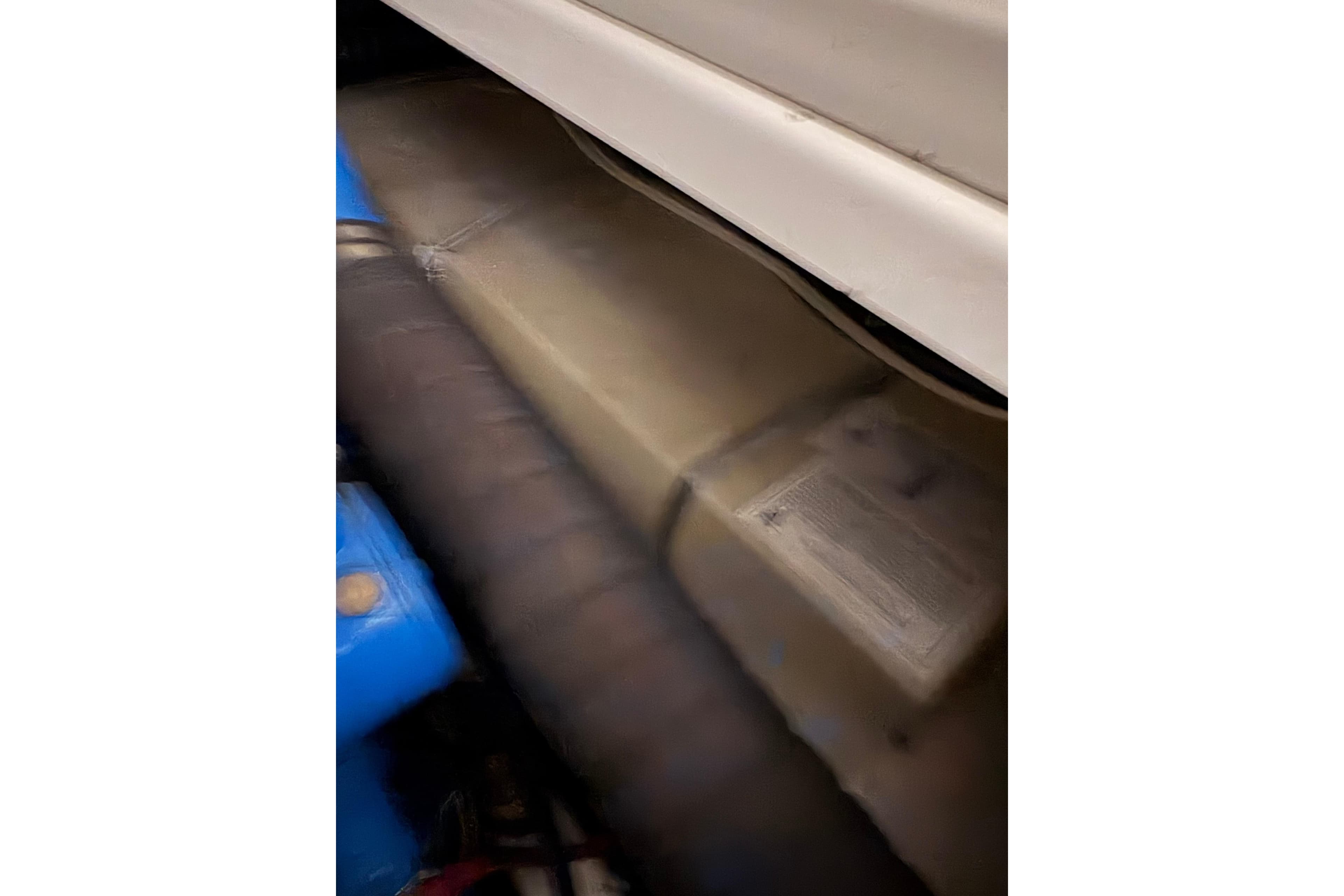 Engine compartment of a 1994 Tiara Yachts 3100 Open, showcasing mechanical components.